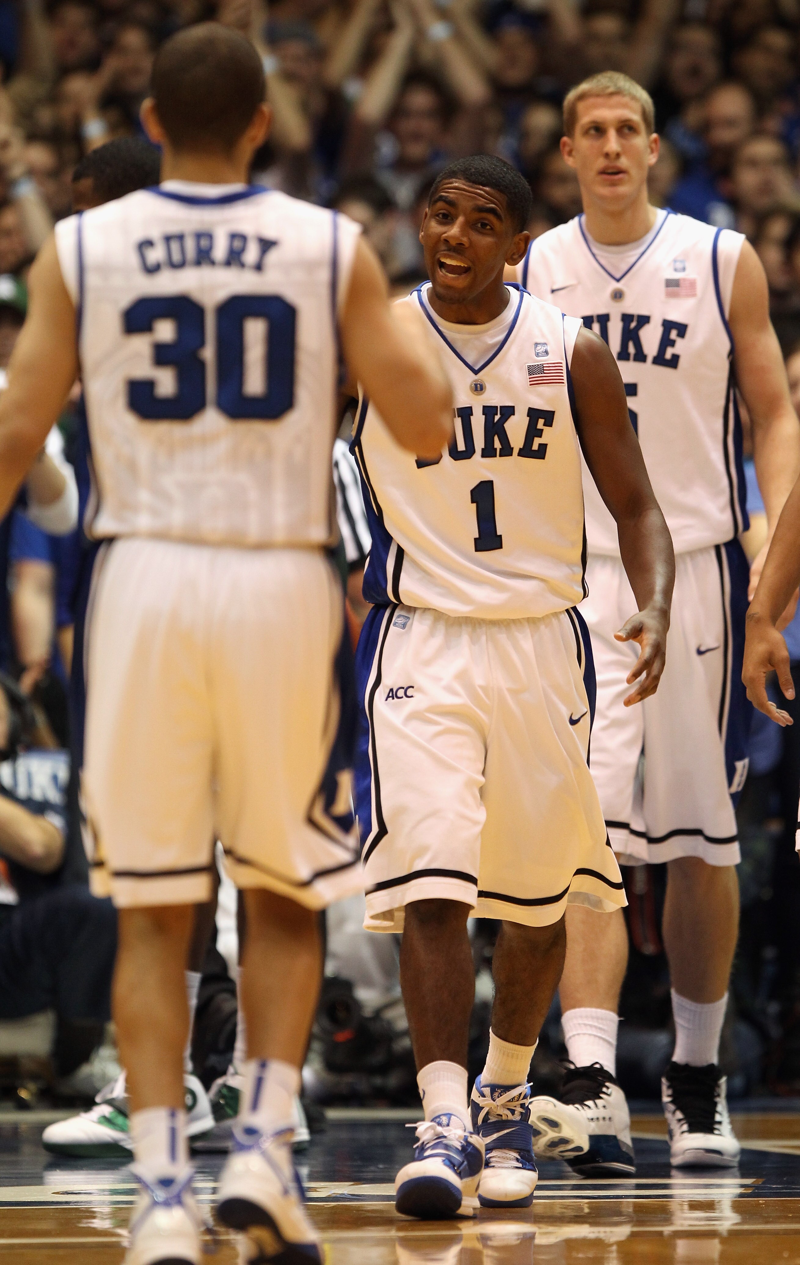 DURHAM, NC - DECEMBER 01:  Kyrie Irving #1 of the Duke Blue Devils celebrates after a basket with teammate Seth Curry #30 during their game against the Michigan State Spartans at Cameron Indoor Stadium on December 1, 2010 in Durham, North Carolina.  (Phot
