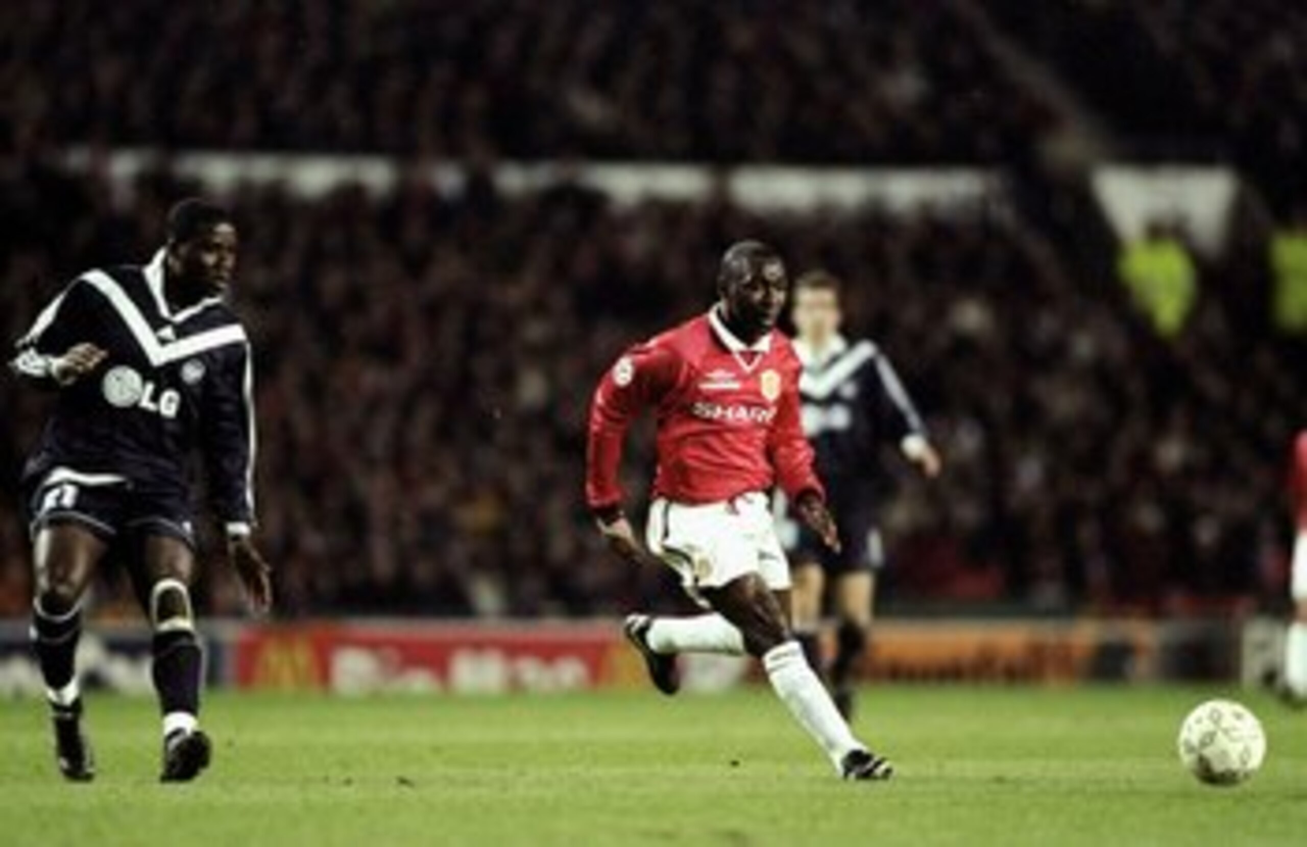 1 Mar 2000:  Andy Cole of Manchester United is watched by Kodjo Afanou of Bordeaux during the UEFA Champions League group B match at Old Trafford in Manchester, England. United won 2-0. \ Mandatory Credit: Alex Livesey /Allsport