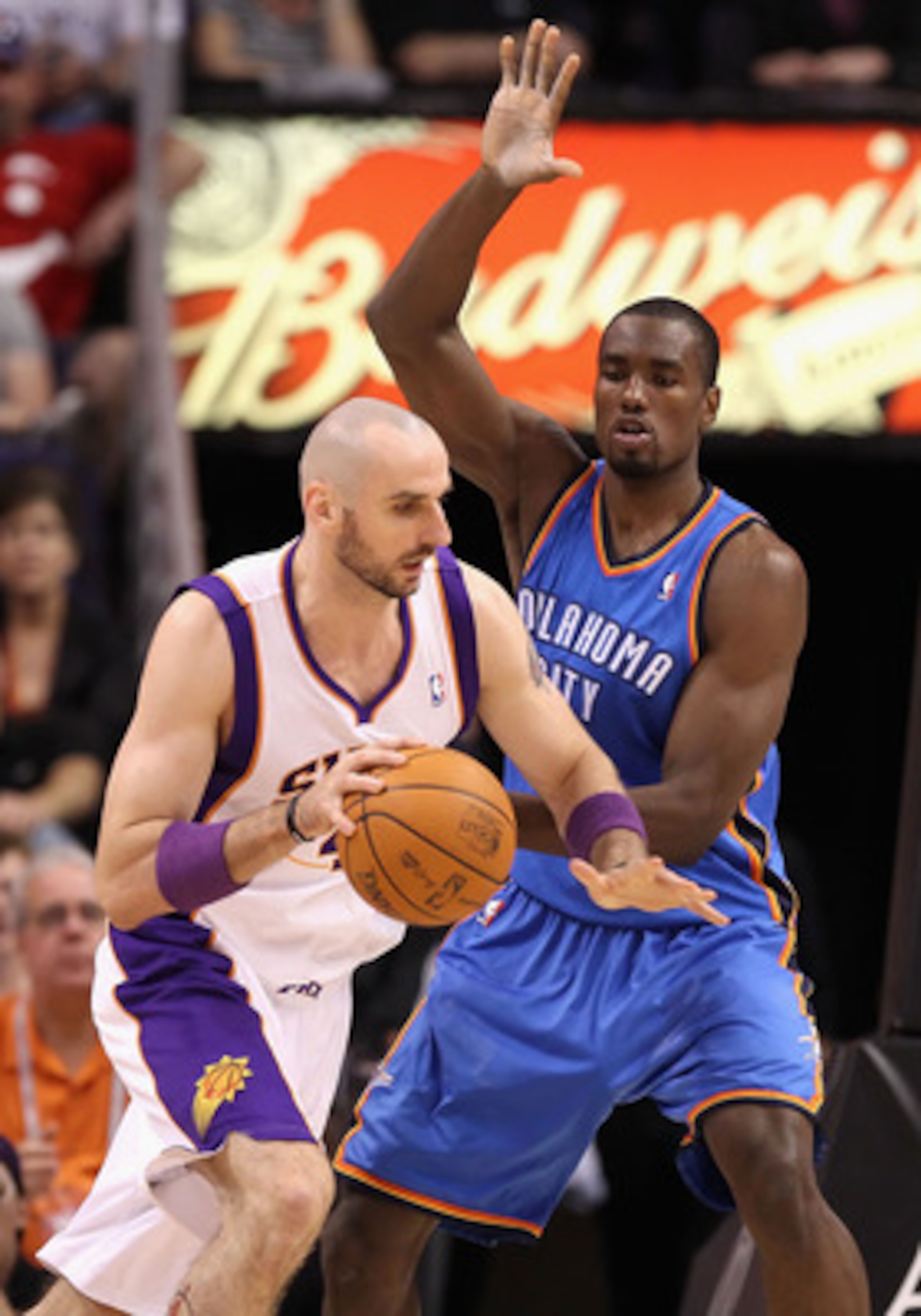 PHOENIX, AZ - MARCH 30:  Marcin Gortat #4 of the Phoenix Suns handles the ball during the NBA game against the Oklahoma City Thunder at US Airways Center on March 30, 2011 in Phoenix, Arizona.  The Thunder defeated the Suns 116-98. NOTE TO USER: User expr