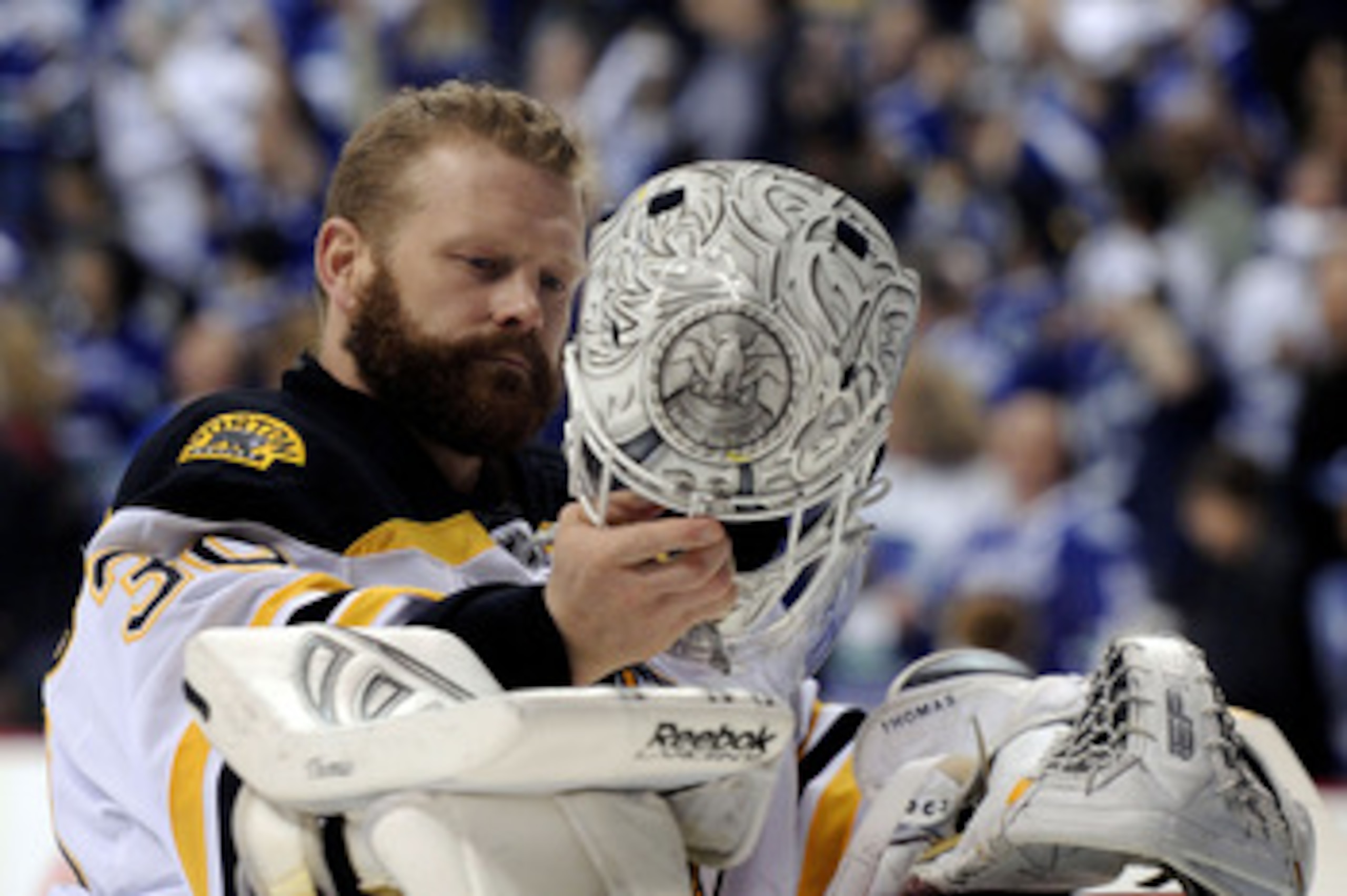 VANCOUVER, BC - JUNE 15: Tim Thomas #30 of the Boston Bruins puts on his helmet prior to the start of Game Seven against the Vancouver Canucks in the 2011 NHL Stanley Cup Final at Rogers Arena on June 15, 2011 in Vancouver, British Columbia, Canada.  (Pho
