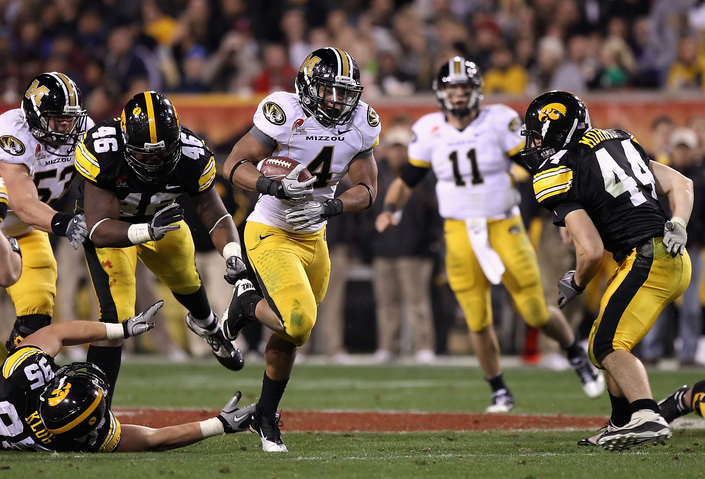 TEMPE, AZ - DECEMBER 28:  Tailback Kendial Lawrence #4 of the Missouri Tigers runs with the football against the Iowa Hawkeyes during the Insight Bowl at Sun Devil Stadium on December 28, 2010 in Tempe, Arizona.  (Photo by Christian Petersen/Getty Images)