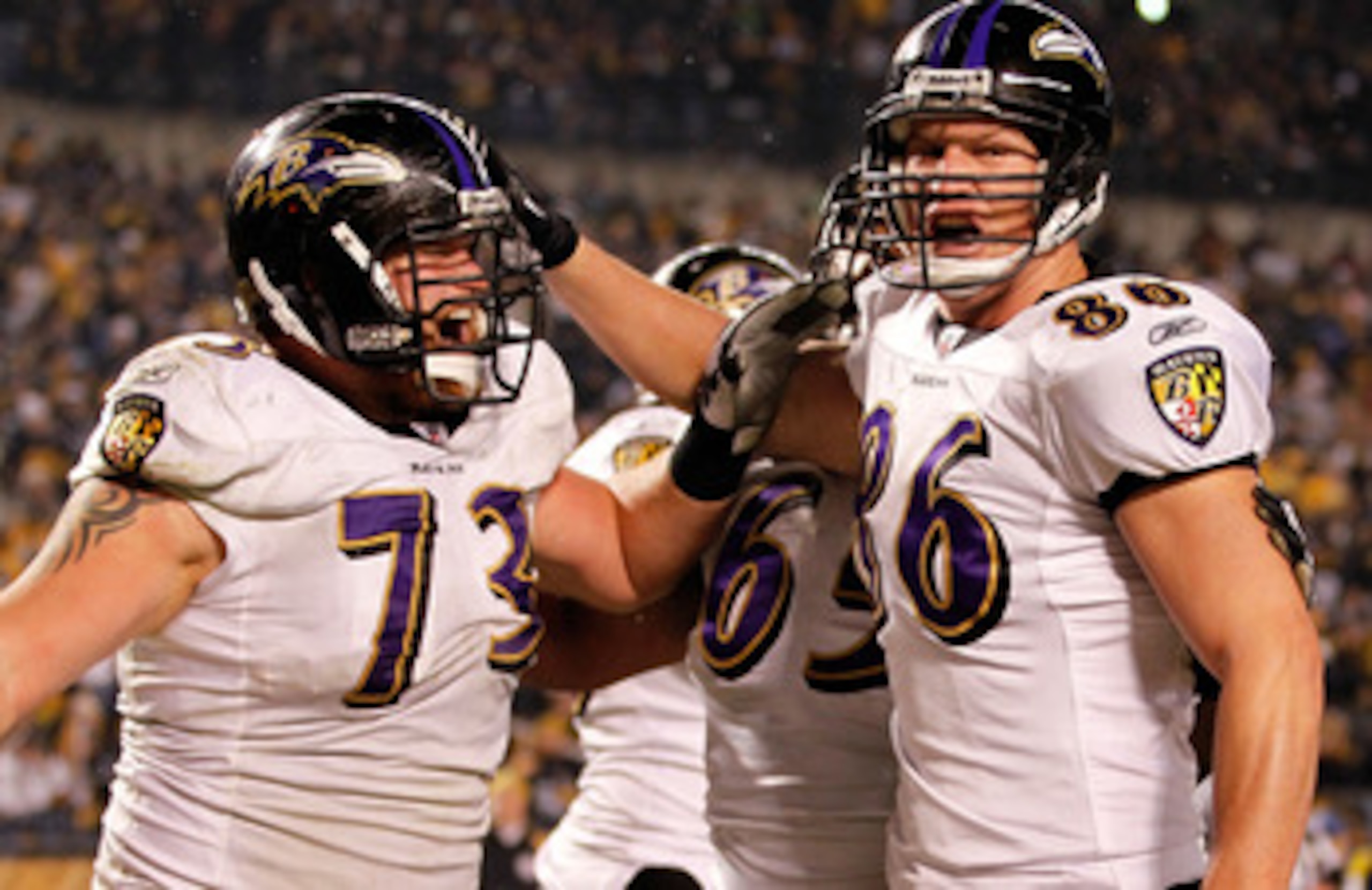 PITTSBURGH, PA - JANUARY 15:  Tight end Todd Heap #86 of the Baltimore Ravens celebrates with teammates after scoring on a four-yard touchdown pass against the Pittsburgh Steelers in the second quarter of the AFC Divisional Playoff Game at Heinz Field on