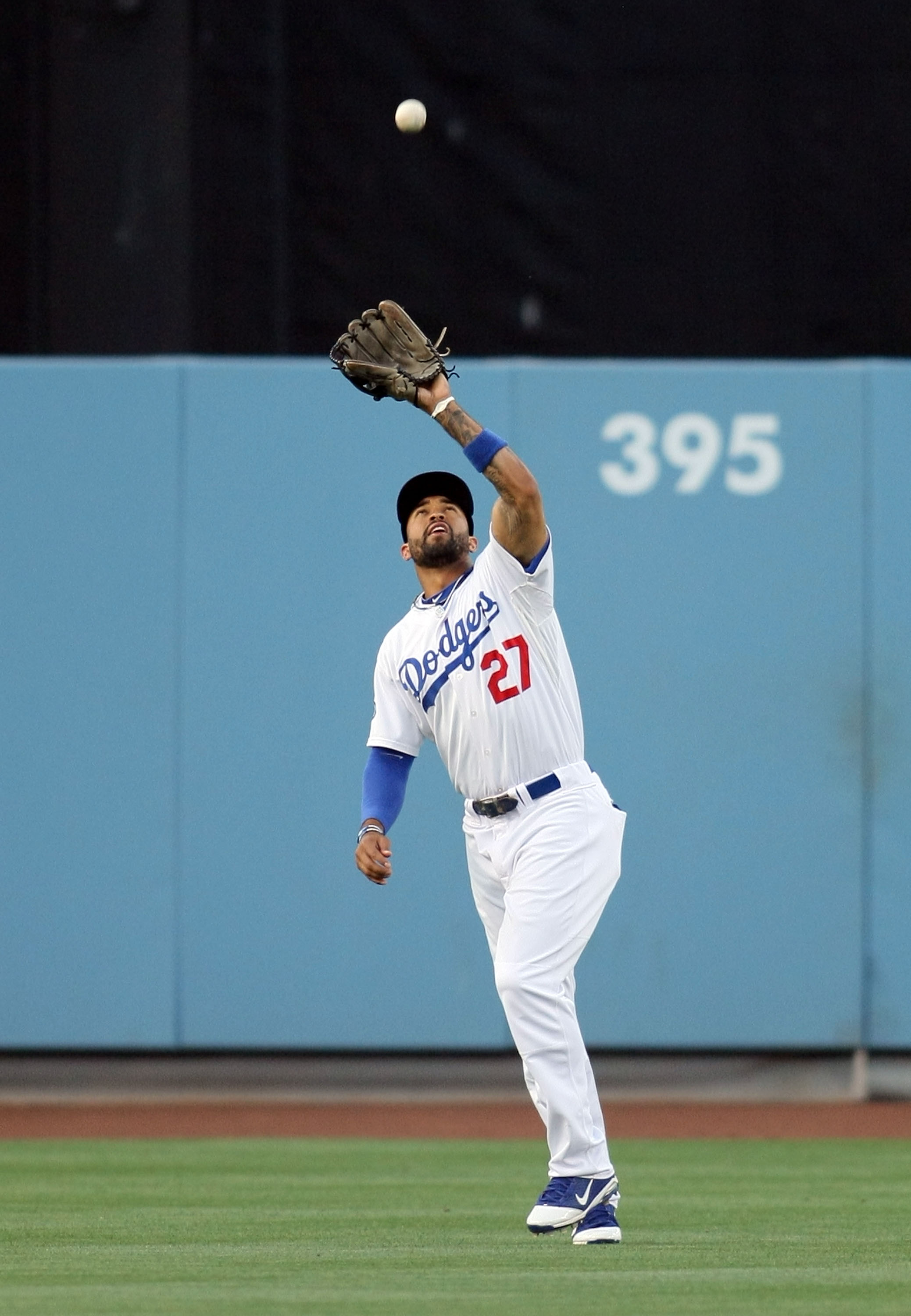 LOS ANGELES, CA - JUNE 17:  Matt Kemp #27 of the Los Angeles Dodgers catches a fly ball for an out in the first inning during the MLB game against the Houston Astros at Dodger Stadium on June 17, 2011 in Los Angeles, California.  (Photo by Victor Decolong