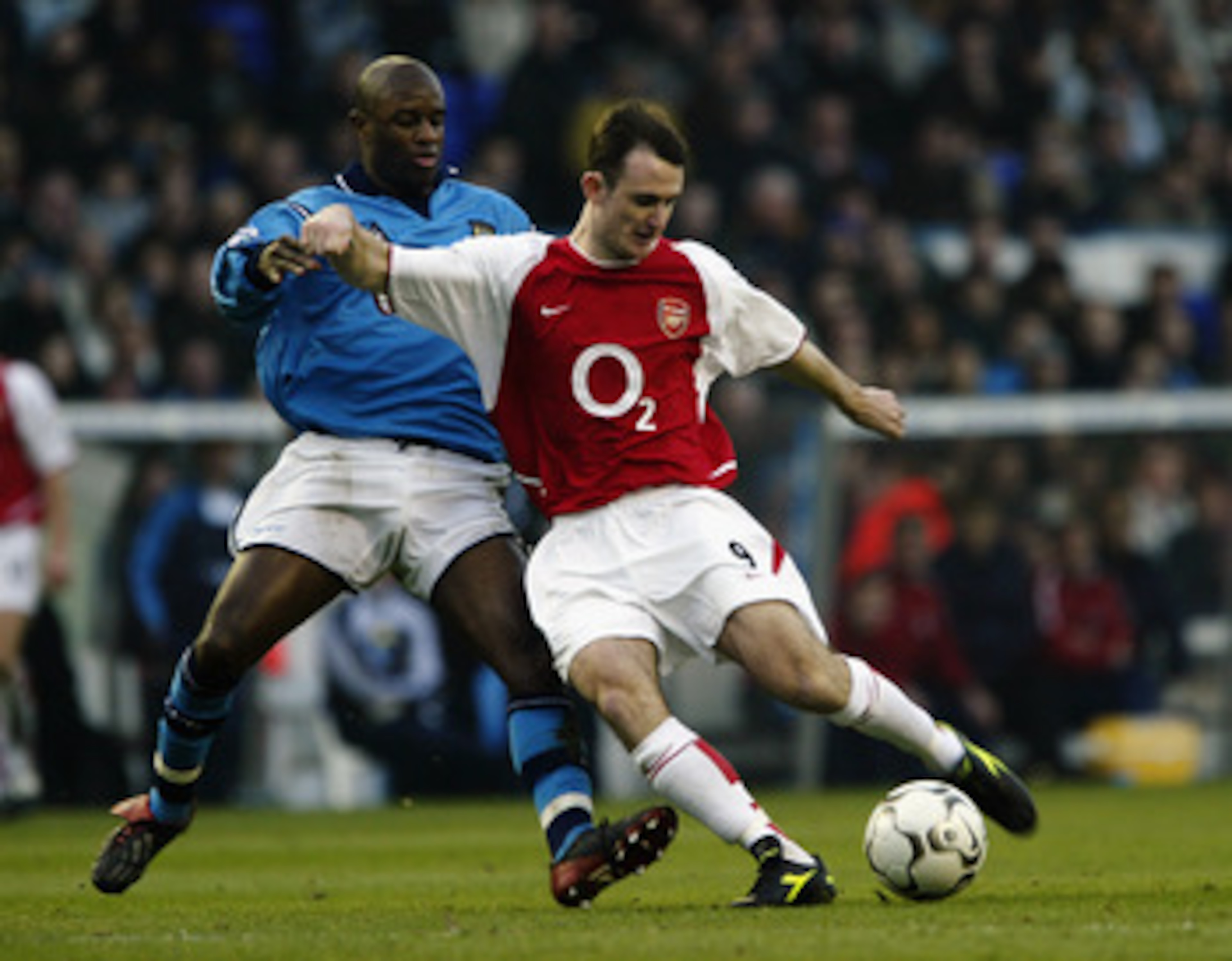 MANCHESTER - FEBRUARY 22:  Francis Jeffers of Arsenal is tackled by David Sommeil of Manchester City during the FA Barclaycard Premiership match held on February 22, 2003 at Maine Road, in Manchester, England. Arsenal won the match 5-1. (Photo by Bryn Len