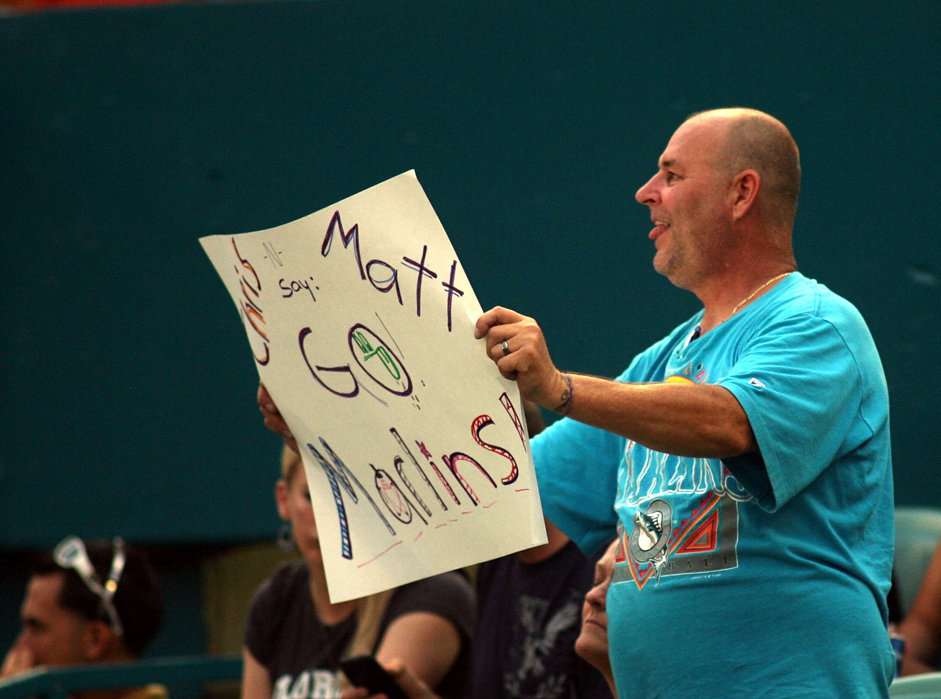 MIAMI GARDENS, FL - JUNE 13:  A Florida Marlins fan holds up a sign against the Arizona Diamondbacks at Sun Life Stadium on June 13, 2011 in Miami Gardens, Florida.  (Photo by Marc Serota/Getty Images)