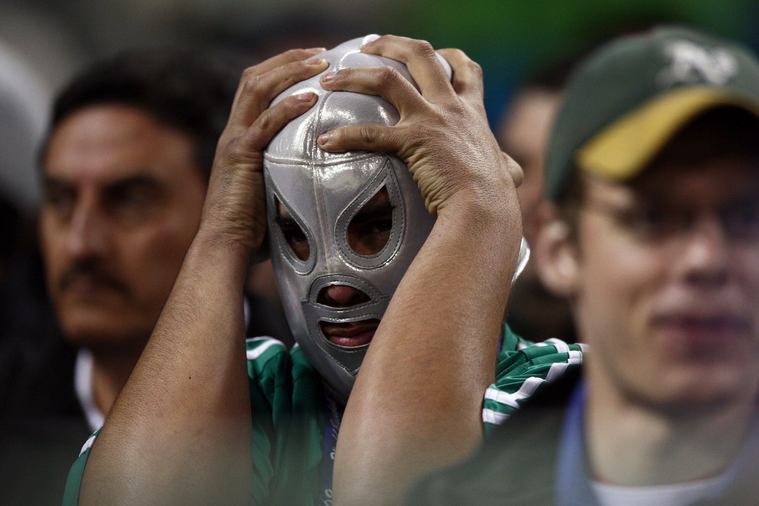 SAN DIEGO - MARCH 16: A Mexican fan holds his head in frustration after Mexico loses to Cuba 7-4 during the 2009 World Baseball Classic Round 2 Pool 1 Game 3 on March 16, 2009 at Petco Park in San Diego, California. (Photo by Donald Miralle/Getty Images SAN DIEGO - MARCH 16: A Mexican fan holds his head in frustration after Mexico loses to Cuba 7-4 during the 2009 World Baseball Classic Round 2 Pool 1 Game 3 on March 16, 2009 at Petco Park in San Diego, California. (Photo by Donald Miralle/Getty Images