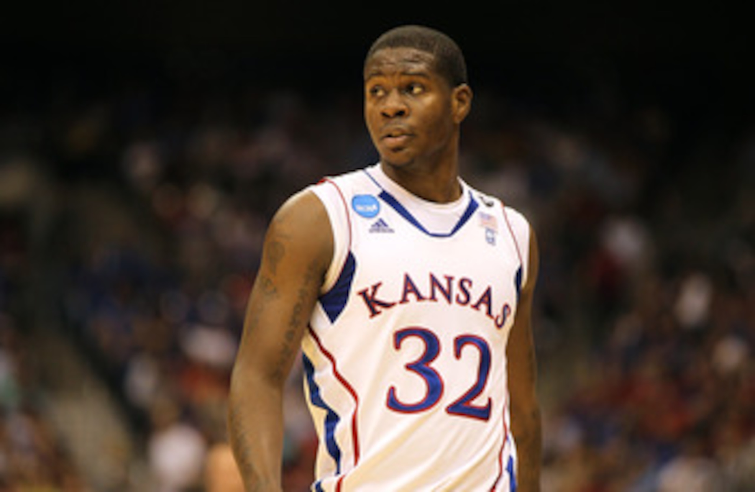 SAN ANTONIO, TX - MARCH 25:  Josh Selby #32 of the Kansas Jayhawks looks on during the southwest regional of the 2011 NCAA men's basketball tournament against the Richmond Spiders at the Alamodome on March 25, 2011 in San Antonio, Texas. Kansas defeated R