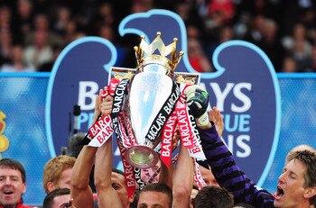 MANCHESTER, ENGLAND - MAY 22: Captain Nemanja Vidic of Manchester United lifts the Premier League trophy after the Barclays Premier League match between Manchester United and Blackpool at Old Trafford on May 22, 2011 in Manchester, England. Manchester Un MANCHESTER, ENGLAND - MAY 22: Captain Nemanja Vidic of Manchester United lifts the Premier League trophy after the Barclays Premier League match between Manchester United and Blackpool at Old Trafford on May 22, 2011 in Manchester, England. Manchester Un
