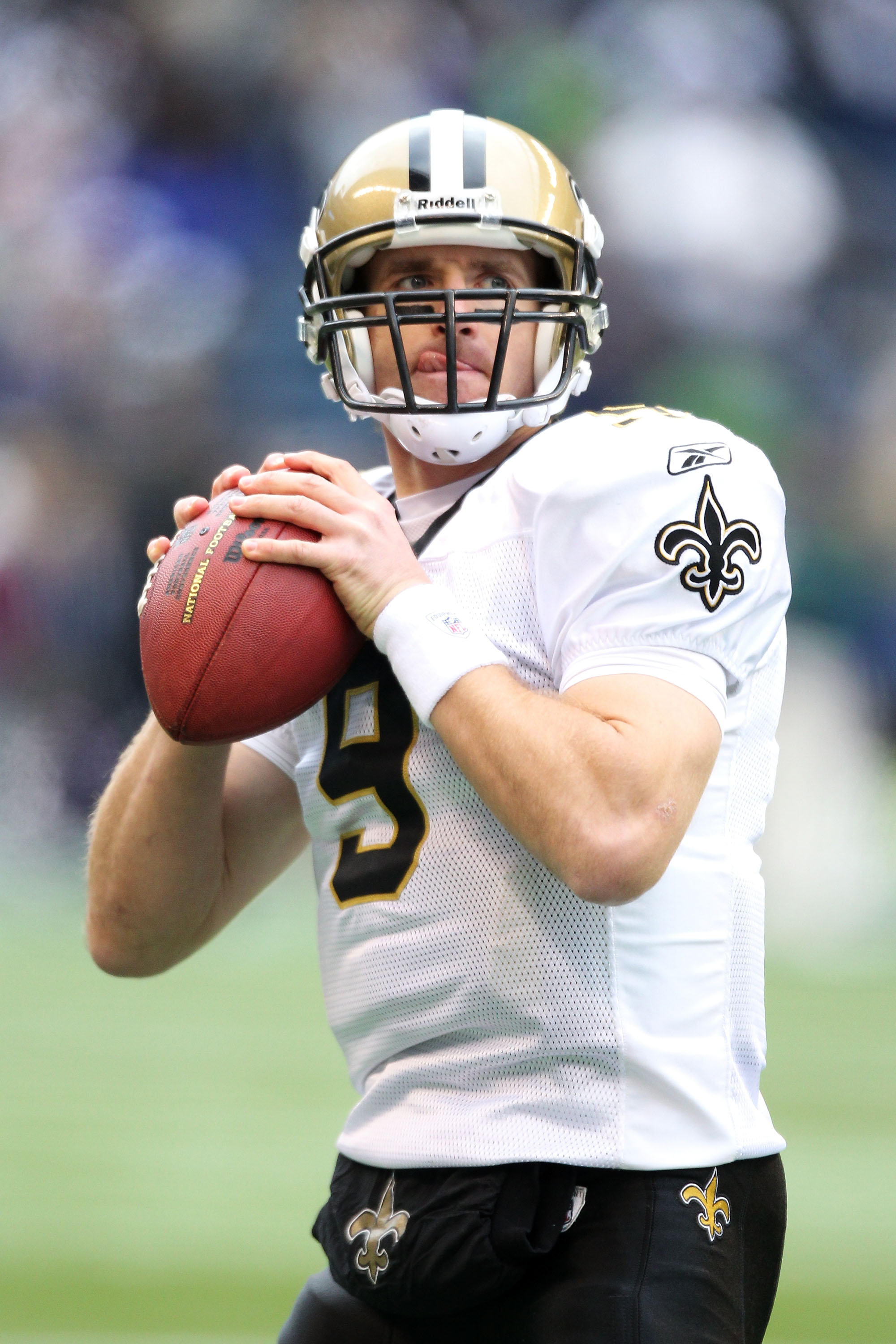 SEATTLE, WA - JANUARY 08:  Quarterback Drew Brees #9 of the New Orleans Saints scrambles against the Seattle Seahawks during the 2011 NFC wild-card playoff game at Qwest Field on January 8, 2011 in Seattle, Washington.  (Photo by Otto Greule Jr/Getty Imag
