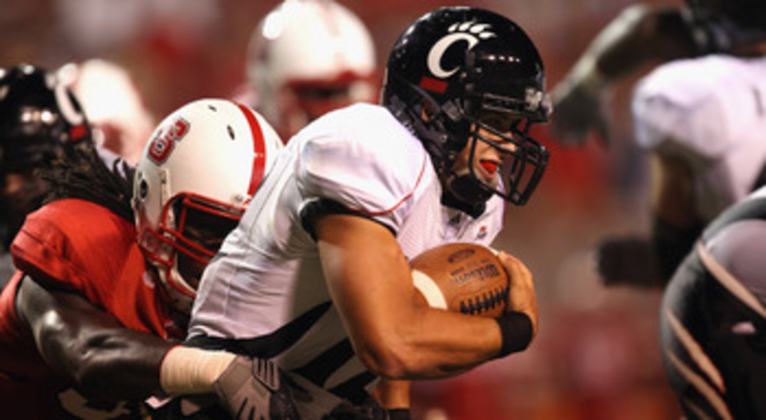 RALEIGH, NC - SEPTEMBER 16:  Zack Collaros #12 of the Cincinnati Bearcats runs with the ball against the North Carolina State Wolfpack during their game at Carter-Finley Stadium on September 16, 2010 in Raleigh, North Carolina.  (Photo by Streeter Lecka/G