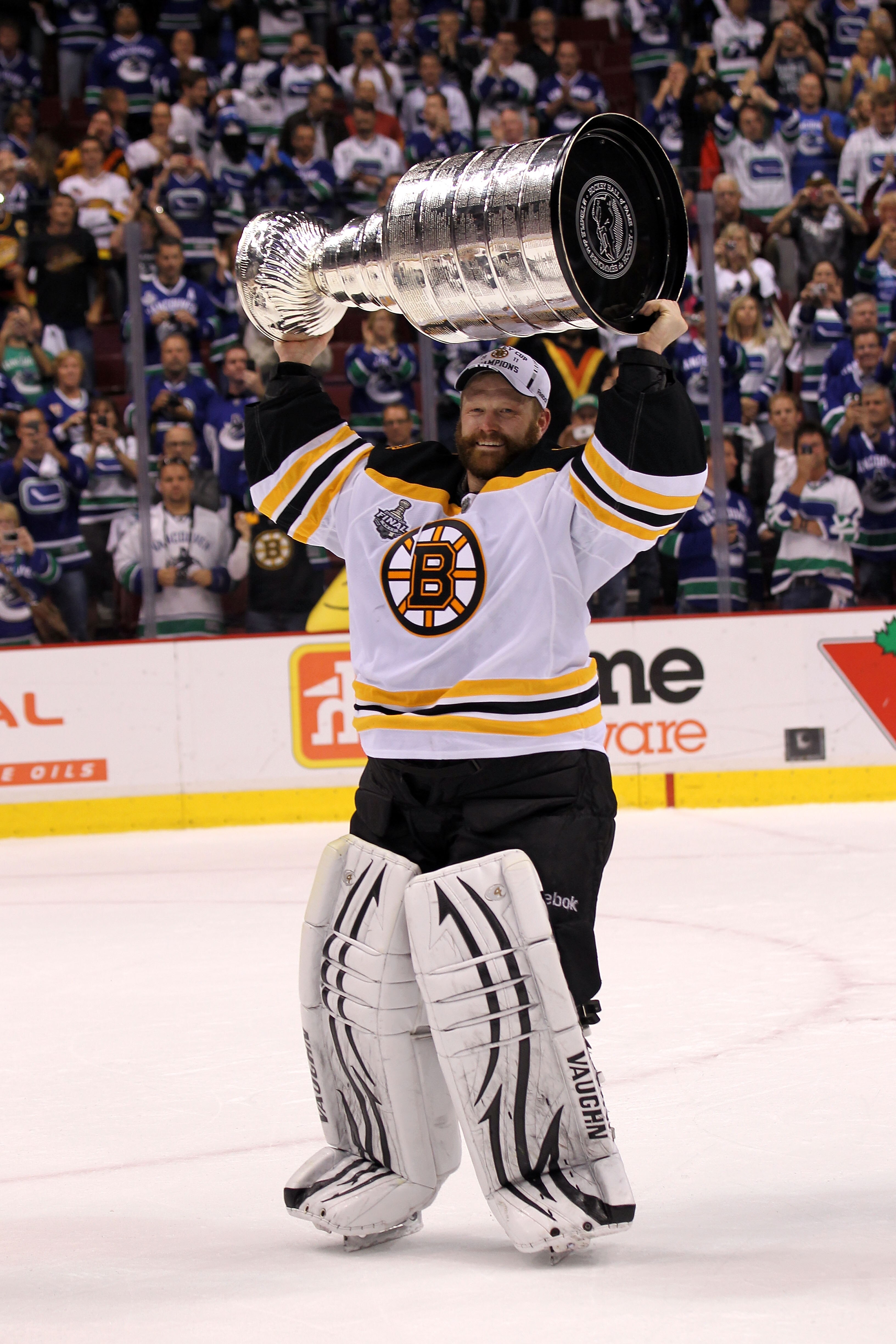 VANCOUVER, BC - JUNE 15:  Tim Thomas #30 of the Boston Bruins celebrates with the Stanley Cup after defeating the Vancouver Canucks in Game Seven of the 2011 NHL Stanley Cup Final at Rogers Arena on June 15, 2011 in Vancouver, British Columbia, Canada. Th