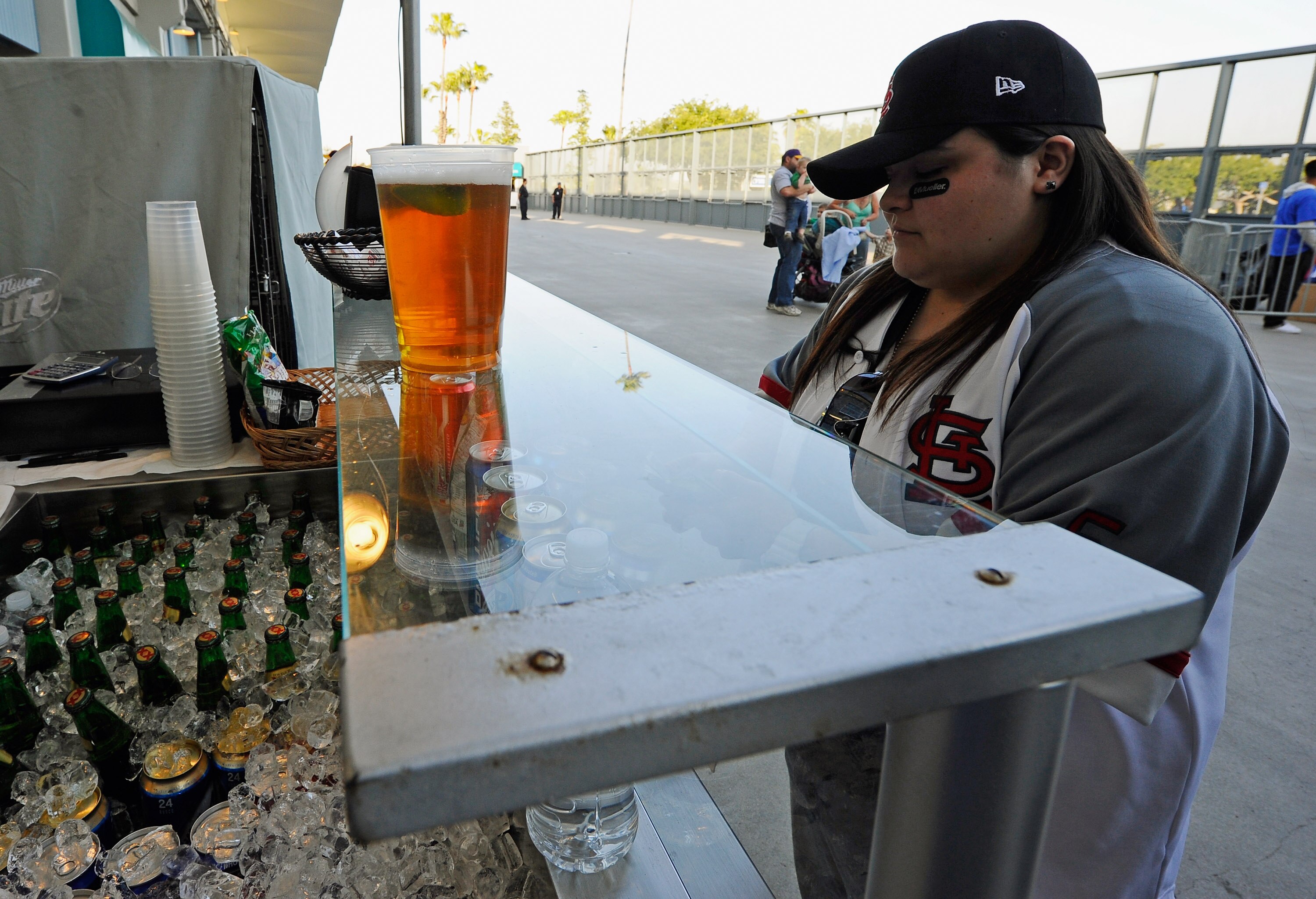 LOS ANGELES, CA - APRIL 14:  A St. Louis Cardinals fan purchases beer at Dodger Stadium prior to the start of the baseball game between the Cardinals and Los Angeles Dodgers on April 14, 2011 in Los Angeles, California. Large numbers of LAPD officers are
