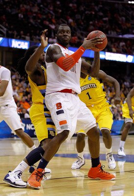 CLEVELAND, OH - MARCH 20: Rick Jackson #00 of the Syracuse Orange handles the ball against the Marquette Golden Eagles during the third of the 2011 NCAA men's basketball tournament at Quicken Loans Arena on March 20, 2011 in Cleveland, Ohio.  (Photo by Gr