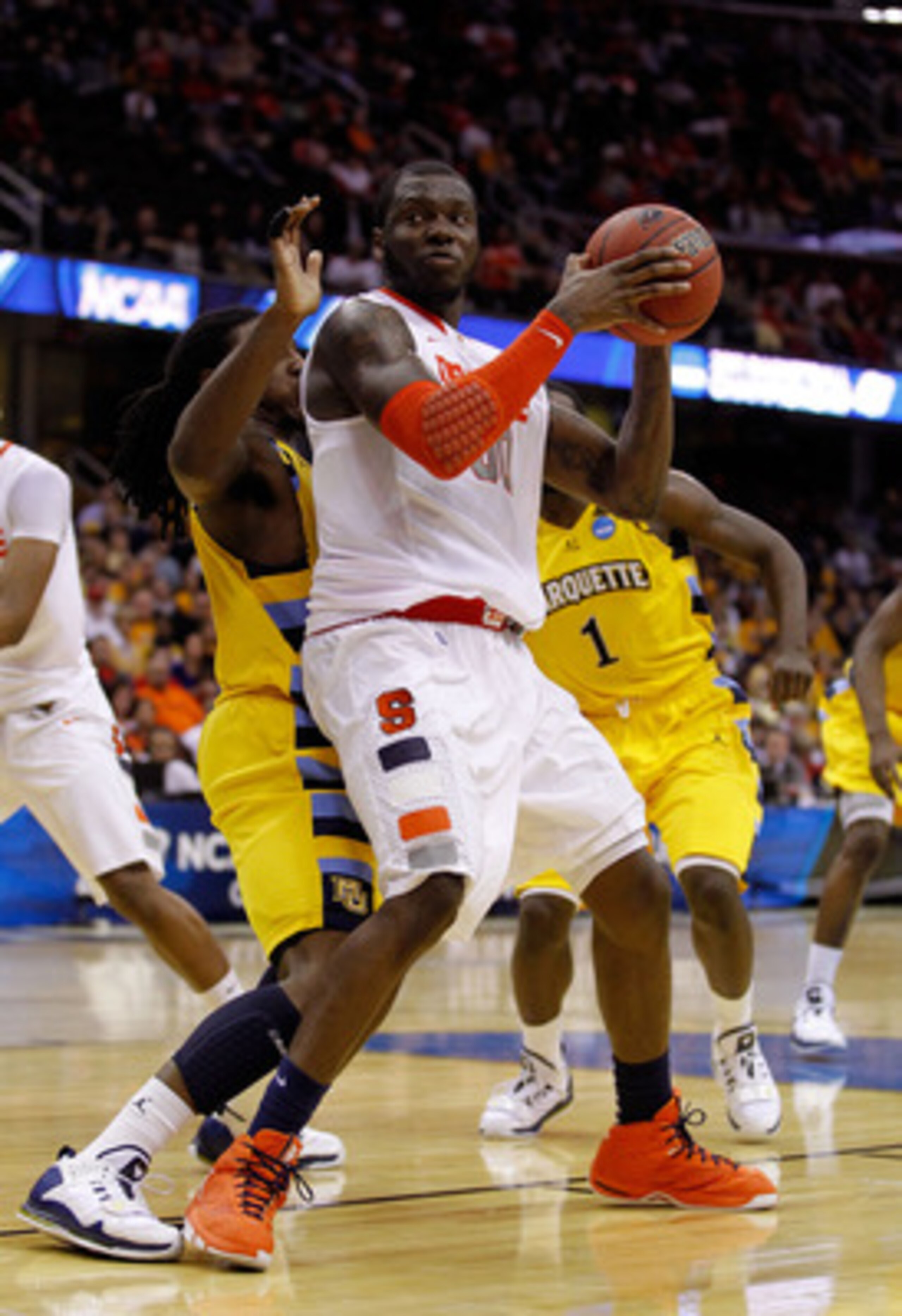 CLEVELAND, OH - MARCH 20: Rick Jackson #00 of the Syracuse Orange handles the ball against the Marquette Golden Eagles during the third of the 2011 NCAA men's basketball tournament at Quicken Loans Arena on March 20, 2011 in Cleveland, Ohio.  (Photo by Gr