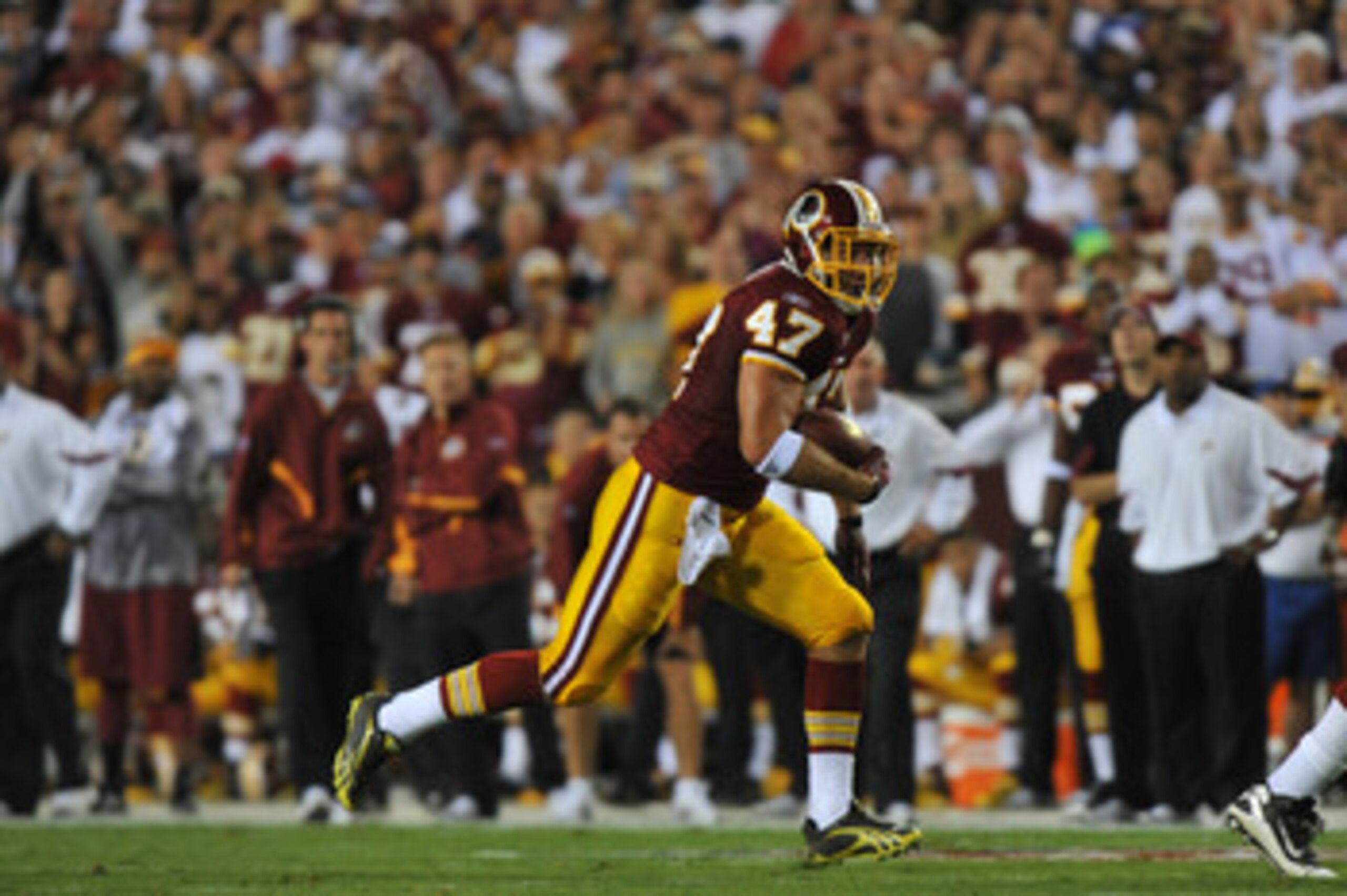LANDOVER - SEPTEMBER 12:  Chris Cooley #47 of the Washington Redskins runs the ball during the NFL season opener against the Dallas Cowboys at FedExField on September 12, 2010 in Landover, Maryland. The Redskins defeated the Cowboys 13-7. (Photo by Larry