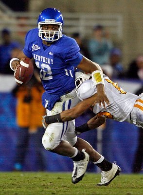 LEXINGTON, KY - NOVEMBER 28:  Morgan Newton #12 of the Kentucky Wildcats is tackled by Janzen Jackson #15 of the Tennessee Volunteers during the SEC game at Commonwealth Stadium on November 28, 2009 in Lexington, Kentucky.  (Photo by Andy Lyons/Getty Imag