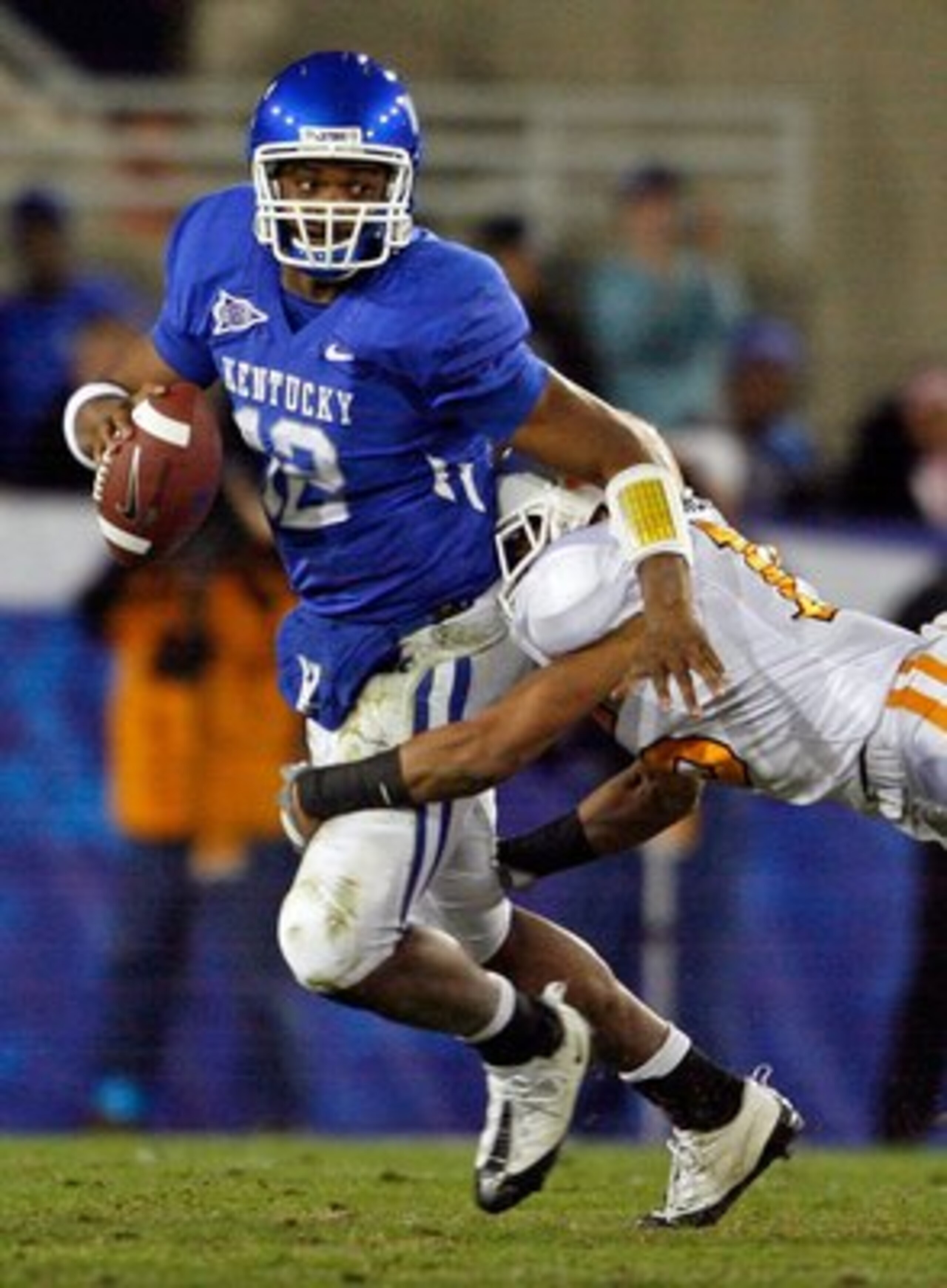 LEXINGTON, KY - NOVEMBER 28:  Morgan Newton #12 of the Kentucky Wildcats is tackled by Janzen Jackson #15 of the Tennessee Volunteers during the SEC game at Commonwealth Stadium on November 28, 2009 in Lexington, Kentucky.  (Photo by Andy Lyons/Getty Imag