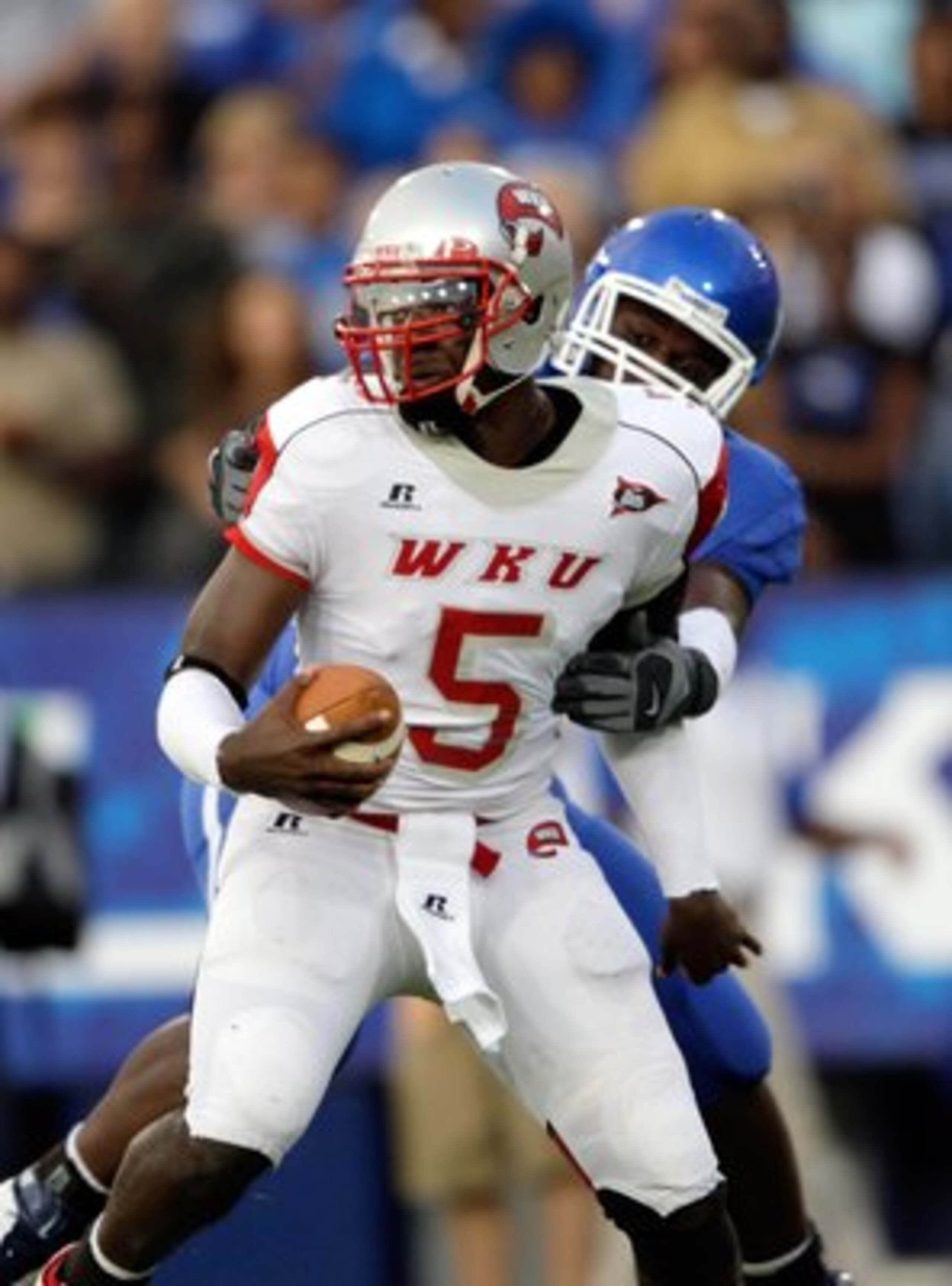 LEXINGTON, KY - SEPTEMBER 27:  Quarterback K.J. Black #5 of the Western Kentucky Hilltoppers looks to make a play with the ball against the Kentucky Wildcats during the game at Commonwealth Stadium on September 27, 2008 in Lexington, Kentucky. The Wildcat