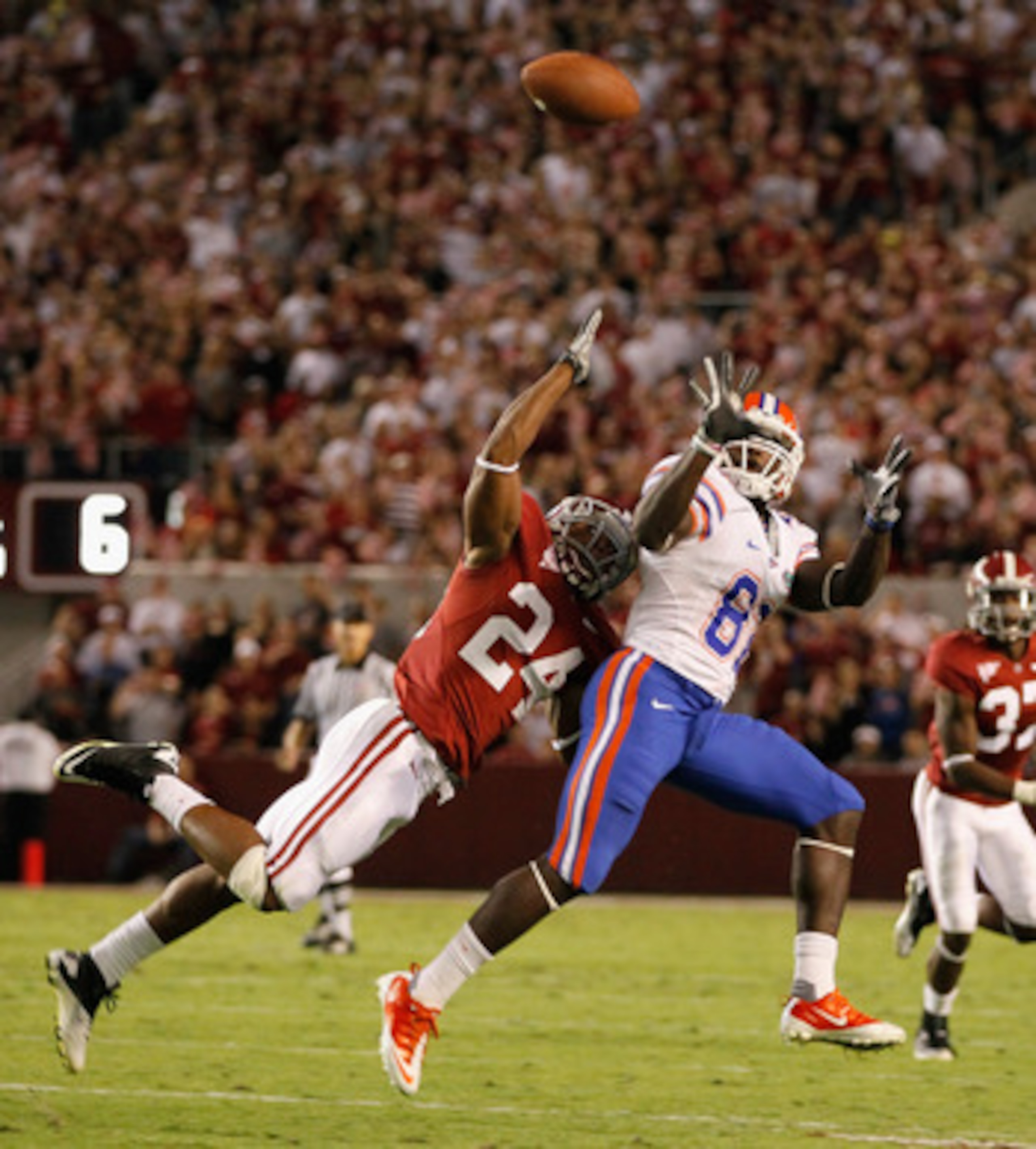TUSCALOOSA, AL - OCTOBER 02:  Omarius Hines #82 of the Florida Gators fails to pull in this reception against DeQuan Menzie #24 of the Alabama Crimson Tide at Bryant-Denny Stadium on October 2, 2010 in Tuscaloosa, Alabama.  (Photo by Kevin C. Cox/Getty Im