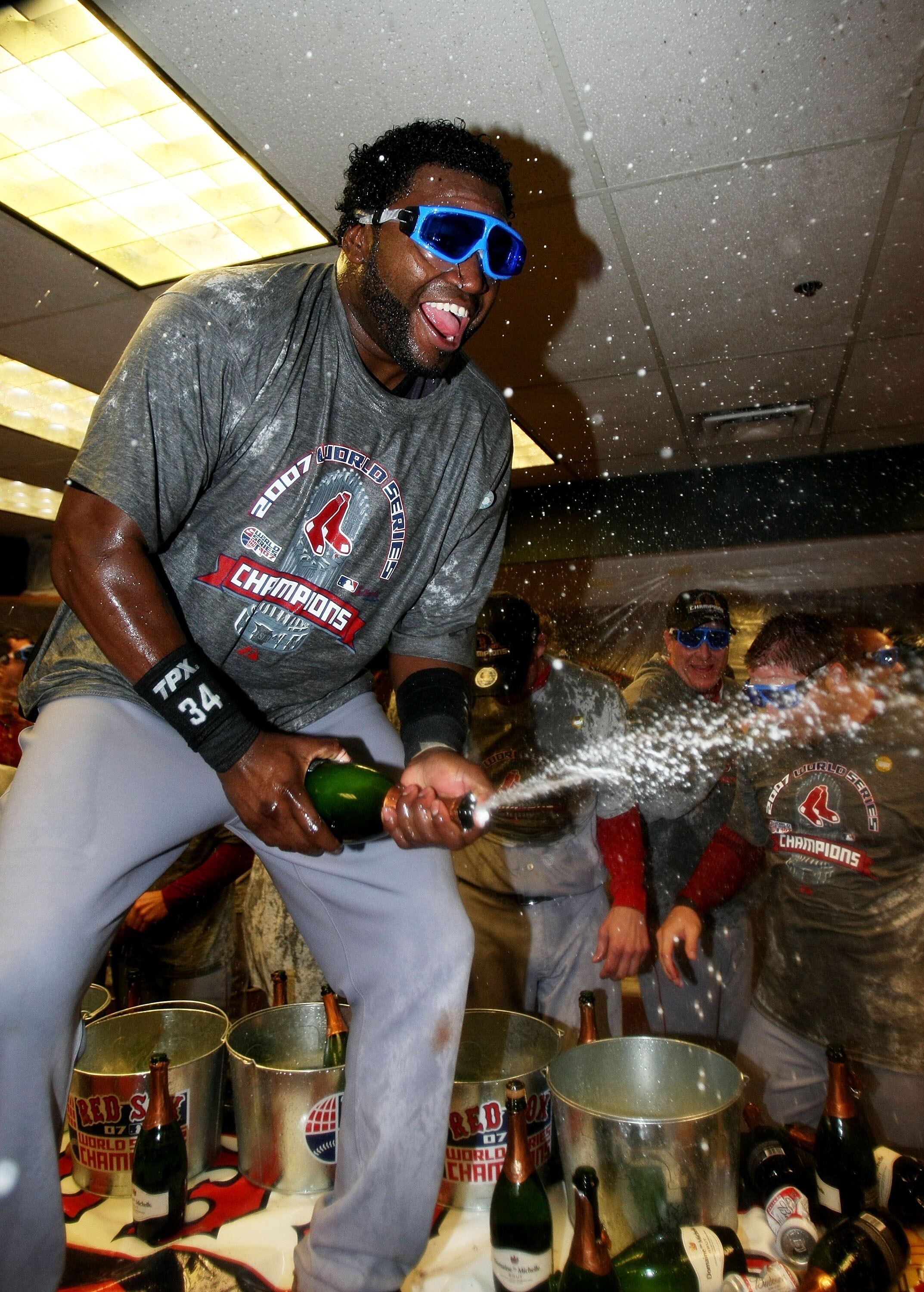 DENVER - OCTOBER 28:  David Ortiz #34 of the Boston Red Sox celebrates with champagne in the locker room after winning Game Four by a score of 4-3 to win the 2007 Major League Baseball World Series in a four game sweep of the Colorado Rockies at Coors Fie