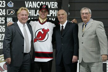 NASHVILLE, TN - JUNE 21:  (L to R) David Conte, first round draft pick (#17 overall) Zach Parise, Lou Lamoriello and Claude Carrier of the New Jersey Devils pose for a portrait on stage during the 2003 NHL Entry Draft at the Gaylord Entertainment Center o