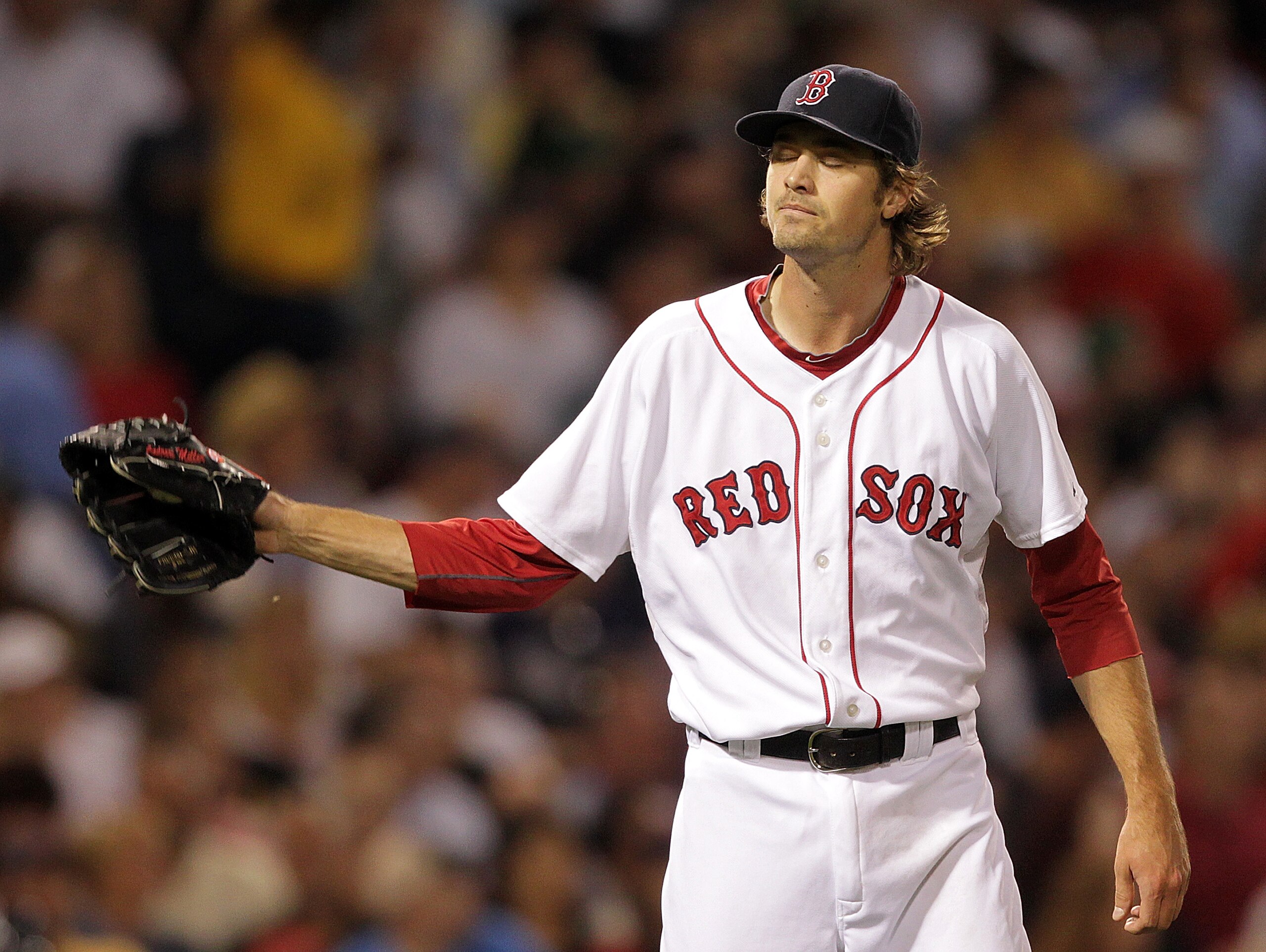 BOSTON, MA  - JUNE 20:  Andrew Miller #30 of the Boston Red Sox reacts after he gave up a three-run home run to Orlando Hudson #1 of the San Diego Padres at Fenway Park on June 20, 2011 in Boston, Massachusetts.  (Photo by Jim Rogash/Getty Images)