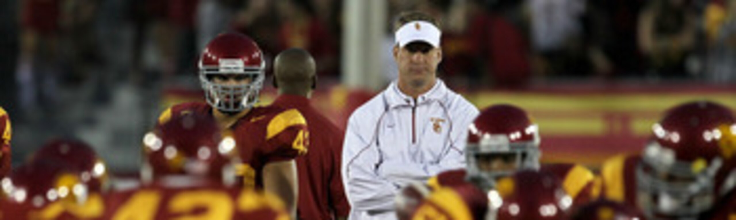 LOS ANGELES - SEPTEMBER 11: Head coach Lane Kiffin watches the USC Trojans warm up for their game with the Virginia Cavaliers at Los Angeles Memorial Coliseum on September 11, 2010 in Los Angeles, California. (Photo by Stephen Dunn/Getty Images) LOS ANGELES - SEPTEMBER 11: Head coach Lane Kiffin watches the USC Trojans warm up for their game with the Virginia Cavaliers at Los Angeles Memorial Coliseum on September 11, 2010 in Los Angeles, California. (Photo by Stephen Dunn/Getty Images)