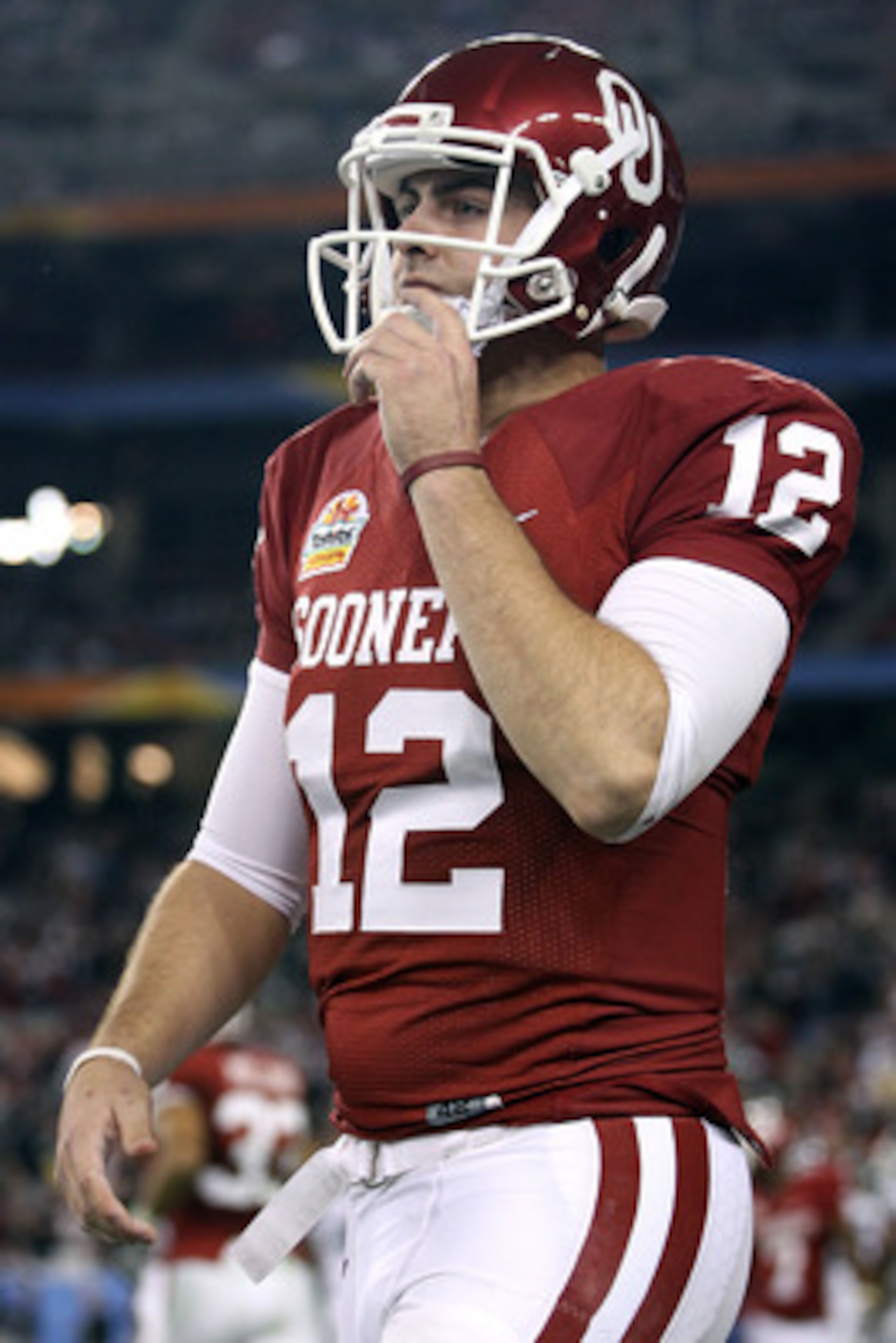 GLENDALE, AZ - JANUARY 01:  Landry Jones #12 of the Oklahoma Sooners looks on against the Connecticut Huskies during the Tostitos Fiesta Bowl at the Universtity of Phoenix Stadium on January 1, 2011 in Glendale, Arizona.  (Photo by Christian Petersen/Gett