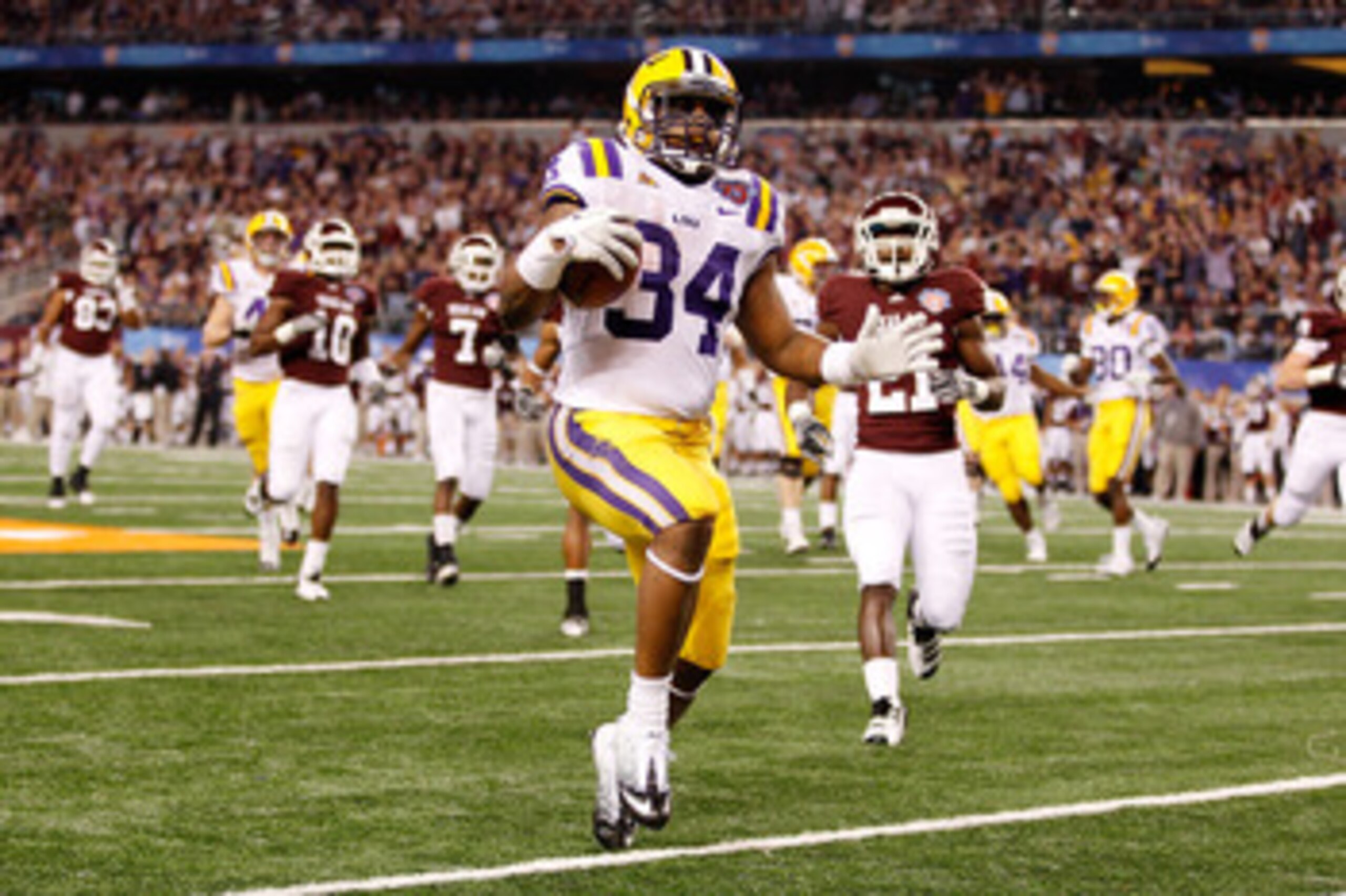 ARLINGTON, TX - JANUARY 07:  Stevan Ridley #34 of the Louisiana State University Tigers runs in for a touchdown during the game against the Texas A&M Aggies during the AT&T Cotton Bowl at Cowboys Stadium on January 7, 2011 in Arlington, Texas.  (Photo by