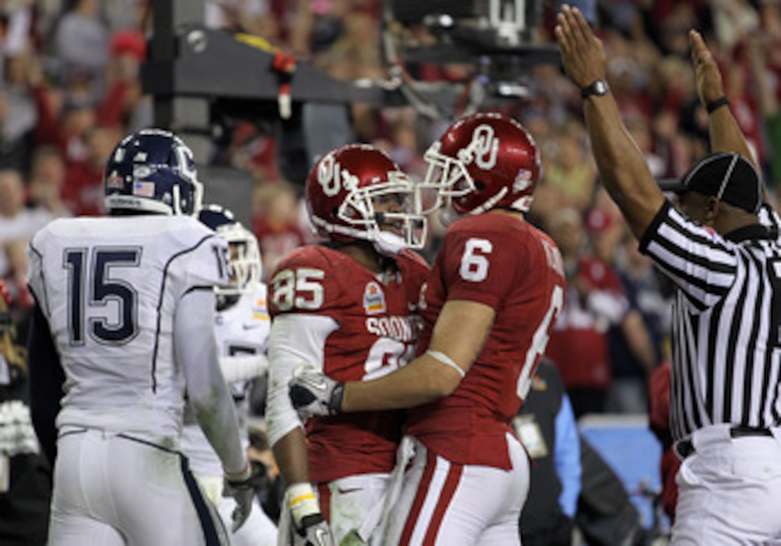 GLENDALE, AZ - JANUARY 01:  Ryan Broyles #85 of the Oklahoma Sooners celebreates with teammate Cameron Kenney #6 after Broyles scores a five-yard touchdown catch in the fourth quarter against Connecticut Huskies during the Tostitos Fiesta Bowl at the Univ