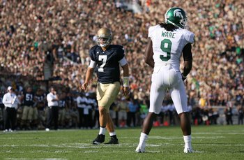SOUTH BEND, IN - SEPTEMBER 19: Quarterback Jimmy Clausen #7 of the Notre Dame Fighting Irish runs a play at wide receiver in the 'wildcat' formation against Jeremy Ware #9 of the Michigan State Spartans on September 19, 2009 at Notre Dame Stadium in South