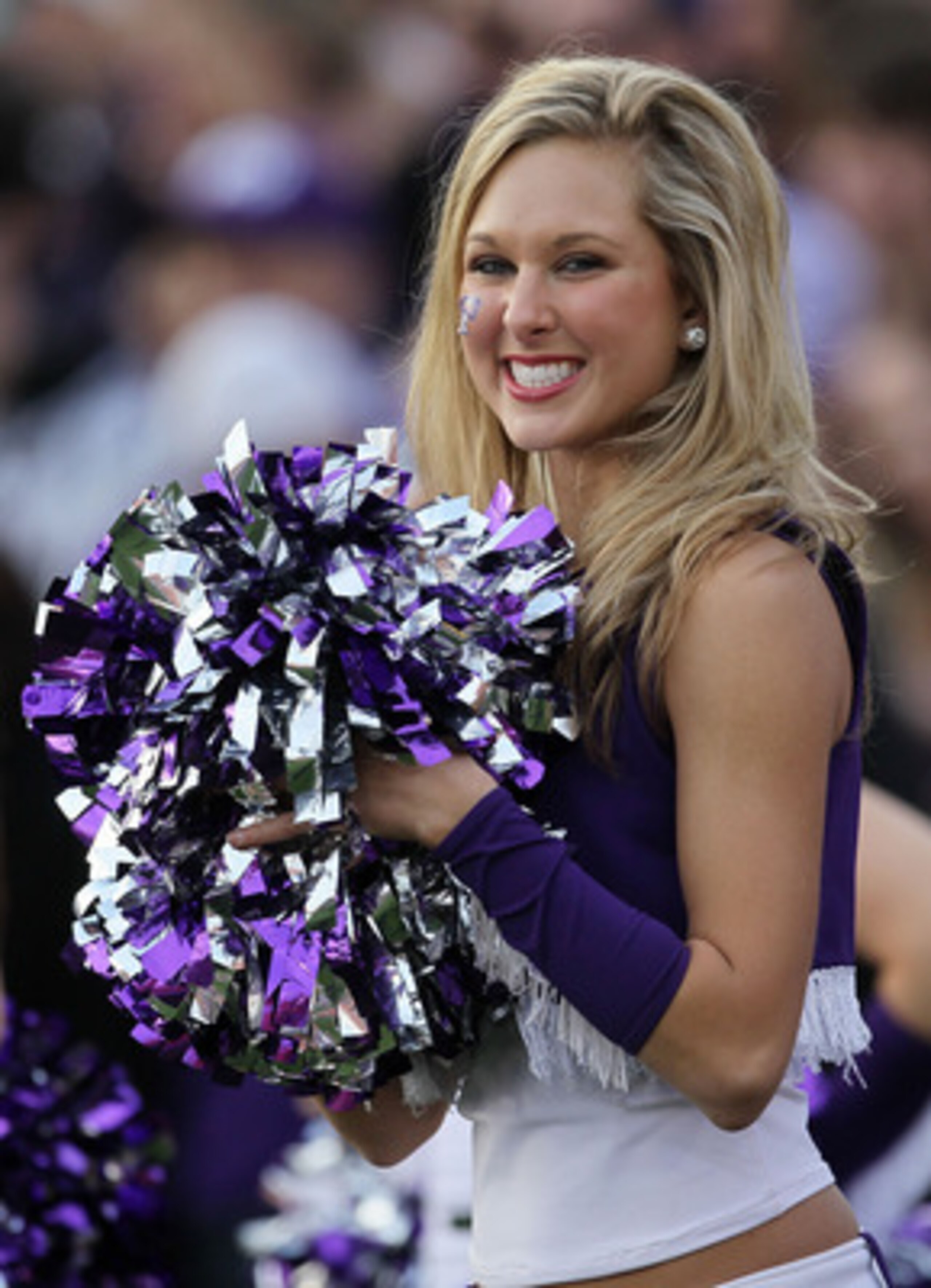 PASADENA, CA - JANUARY 01:  A cheerleader of the TCU Horned Frogs performs during the 97th Rose Bowl game against the Wisconsin Badgers on January 1, 2011 in Pasadena, California.  (Photo by Stephen Dunn/Getty Images)