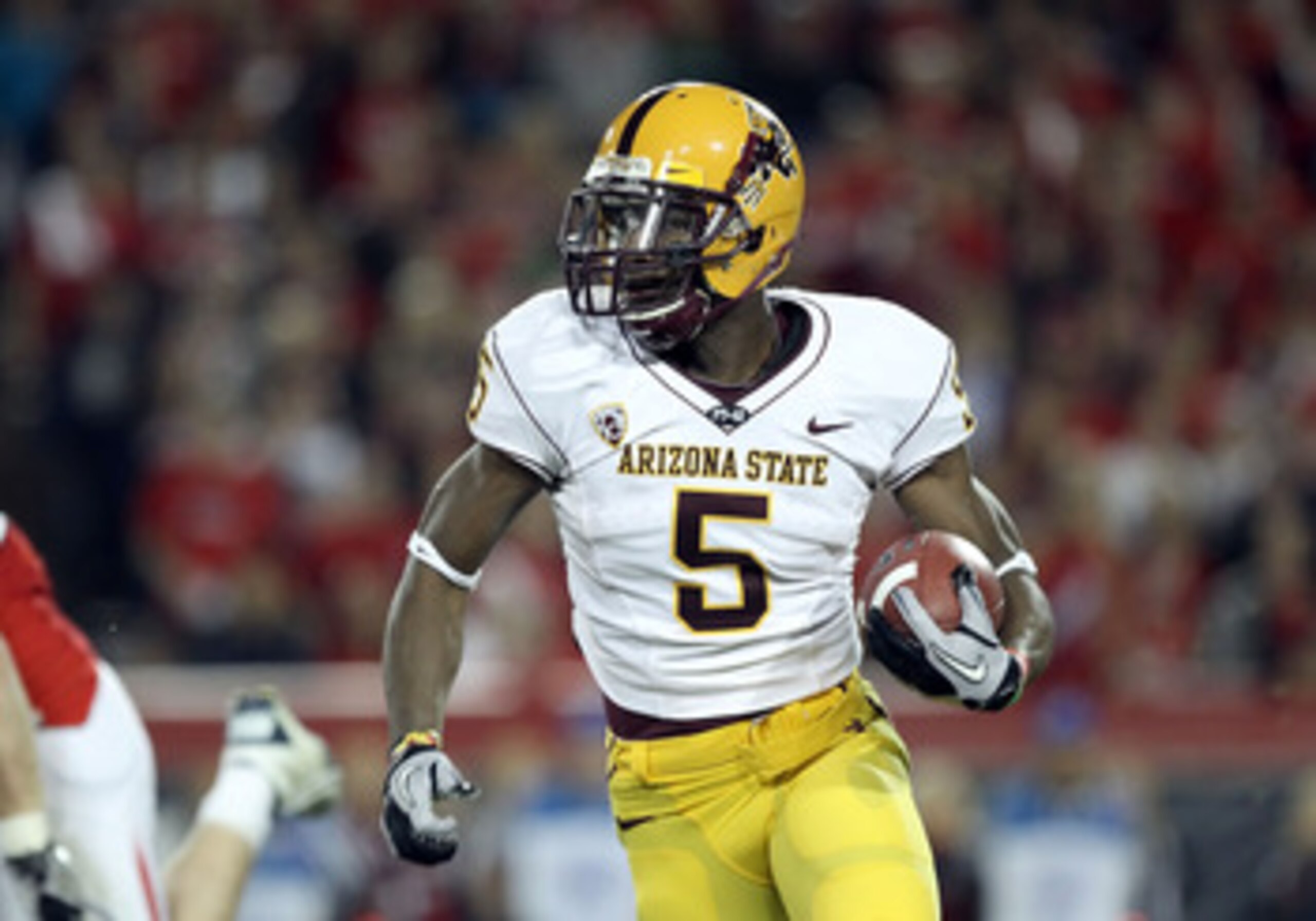TUCSON, AZ - DECEMBER 02:  Wide receiver Kerry Taylor #5 of the Arizona State Sun Devils runs with the football during the college football game at Arizona Stadium on December 2, 2010 in Tucson, Arizona. The Sun Devils defeated the Wildcats 30-29 in doubl