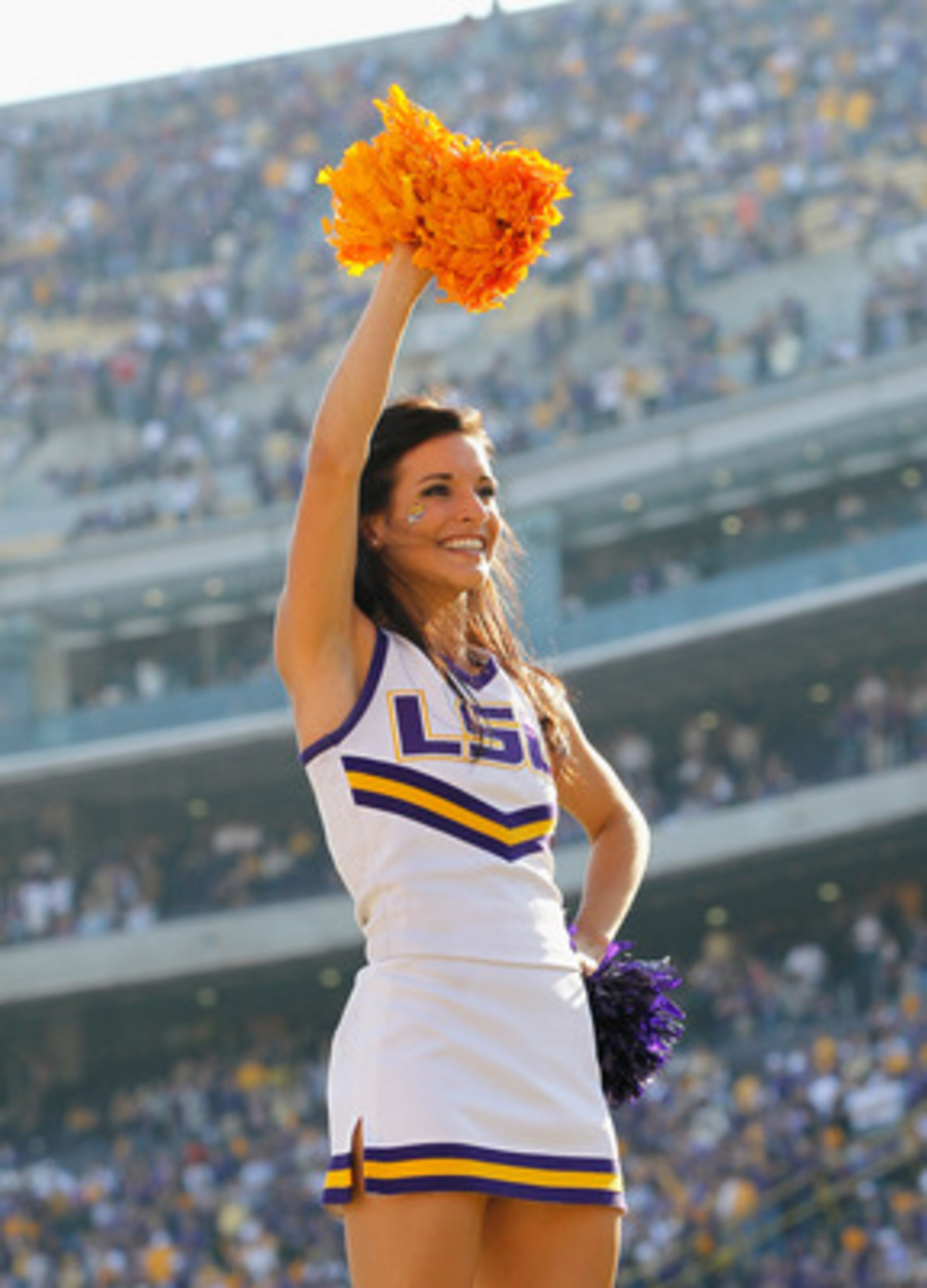 BATON ROUGE, LA - NOVEMBER 20:  A cheerleaderof the Louisiana State University Tigers cheers against the Ole Miss Rebels at Tiger Stadium on November 20, 2010 in Baton Rouge, Louisiana.  (Photo by Kevin C. Cox/Getty Images)
