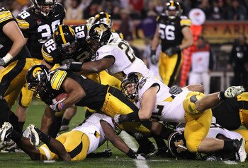 TEMPE, AZ - DECEMBER 28:  Runningback Marcus Coker #34 of the Missouri Tigers runs with the football against the Iowa Hawkeyes during the Insight Bowl at Sun Devil Stadium on December 28, 2010 in Tempe, Arizona.  (Photo by Christian Petersen/Getty Images)