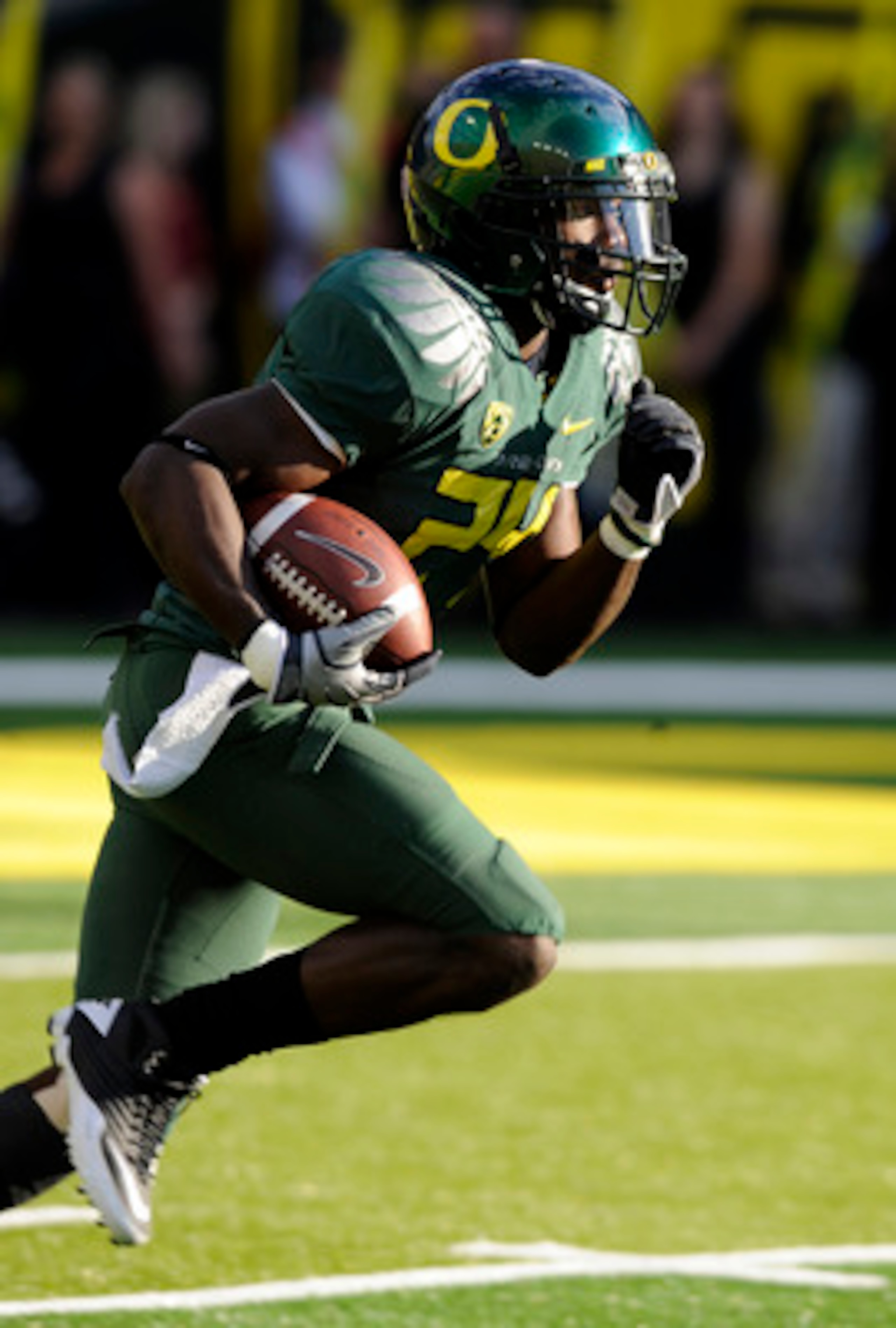 EUGENE, OR - OCTOBER 2: Running back Kenjon Barner #24 of the Oregon Ducks runs back a kickoff in the first quarter of the game against the Stanford Cardinal at Autzen Stadium on October 2, 2010 in Eugene, Oregon. Oregon won the game 52-31. (Photo by Stev