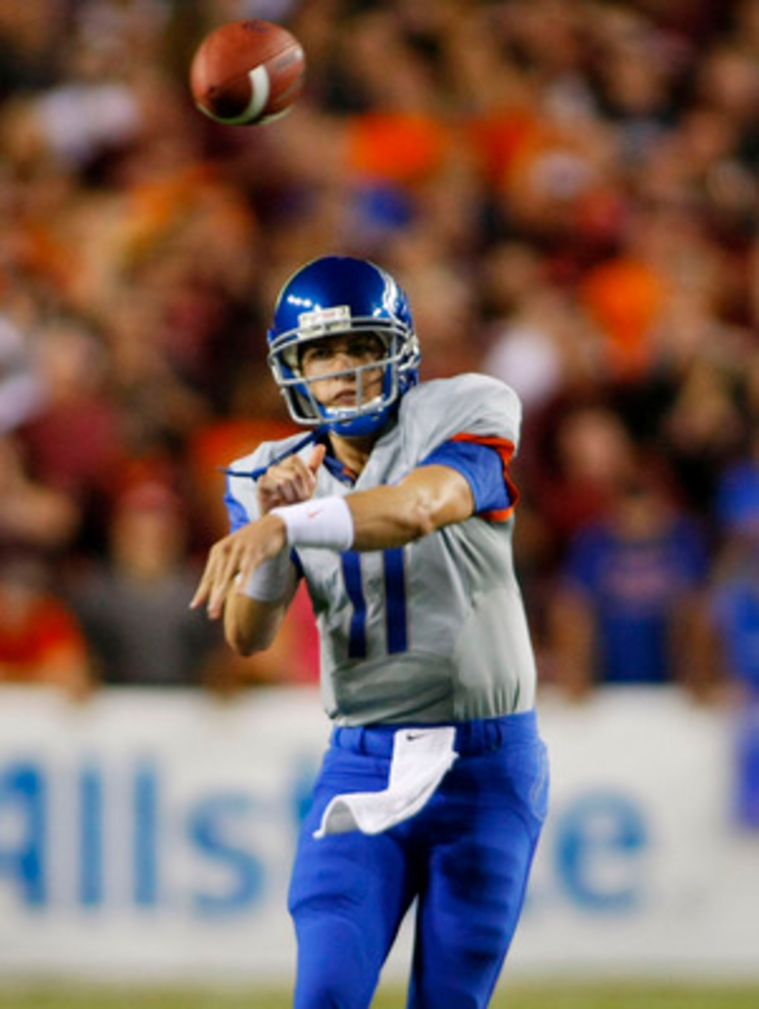 LANDOVER, MD - SEPTEMBER 06:  Quarterback Kellen Moore #11 of the Boise State Broncos passes against the Virginia Tech Hokies at FedExField on September 6, 2010 in Landover, Maryland.  (Photo by Geoff Burke/Getty Images)