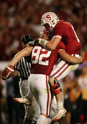 MIAMI, FL - JANUARY 03: Quarterback Andrew Luck #12 and Coby Fleener #82 of the Stanford Cardinal celebrate after Luck threw Fleener a 41-yard touchdown pass in the third quarterback against the Virginia Tech Hokies during the 2011 Discover Orange Bowl at