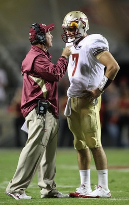 RALEIGH, NC - OCTOBER 28:  Head coach Jimbo Fisher and quarterback Christian Ponder #7 of the Florida State Seminoles prepare for a play against the North Carolina State Wolfpack at Carter-Finley Stadium on October 28, 2010 in Raleigh, North Carolina.  (P