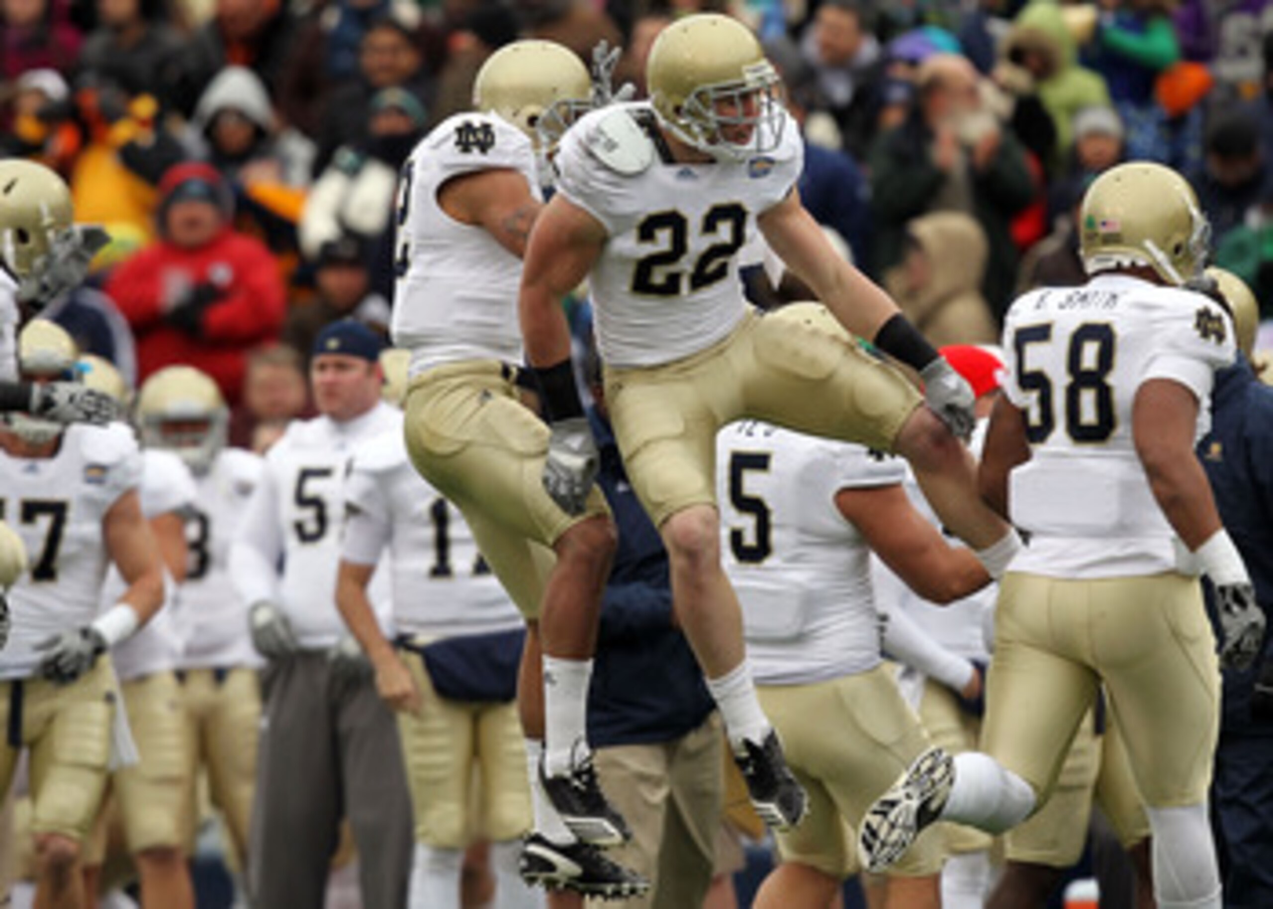 EL PASO, TX - DECEMBER 30:  Safety Harrison Smith #22 celebrates a pass interception with Robert Blanton #12 of the Notre Dame Fighting Irish during play against the Miami Hurricanes at Sun Bowl on December 30, 2010 in El Paso, Texas.  (Photo by Ronald Ma
