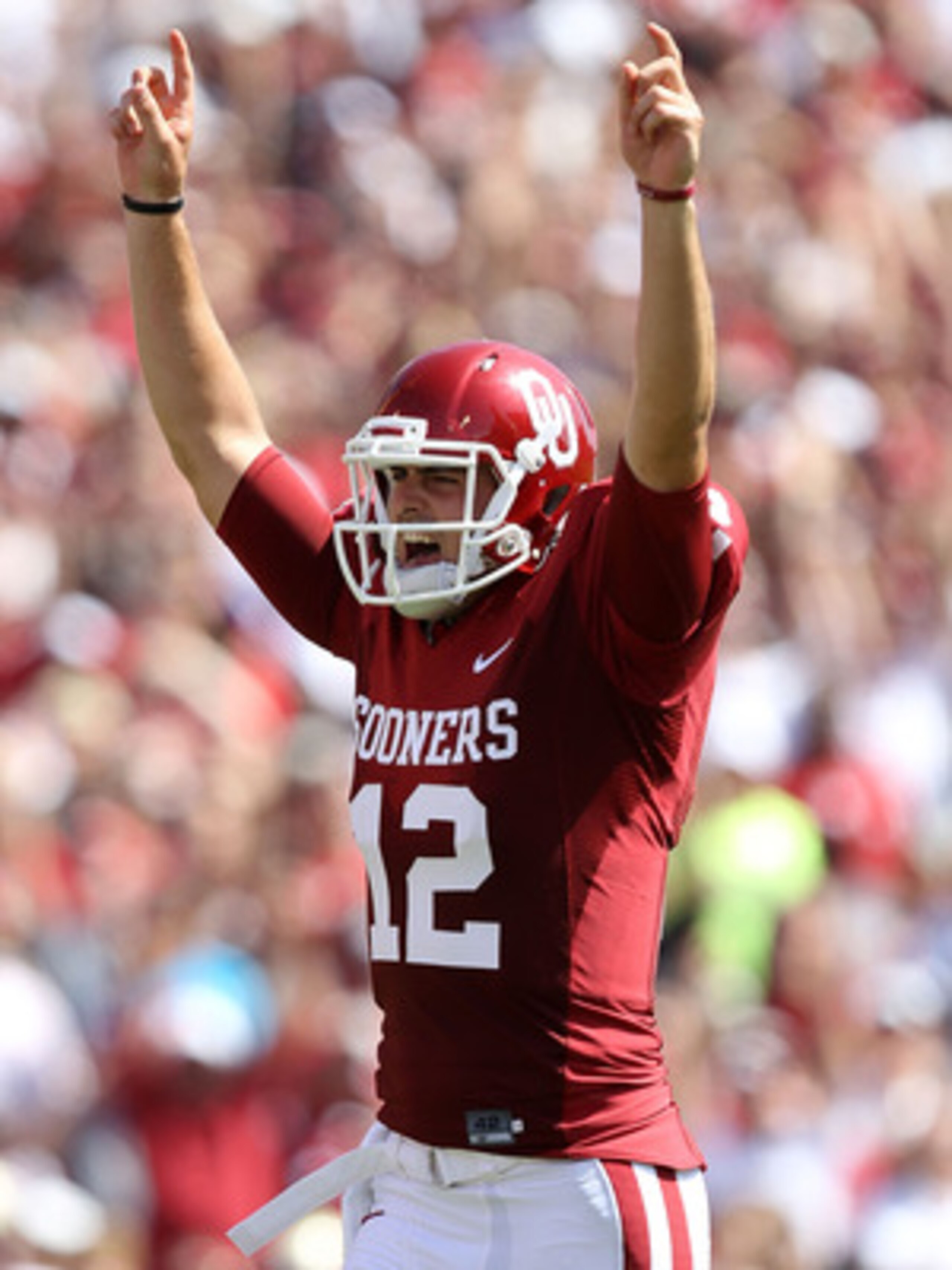 NORMAN, OK - SEPTEMBER 11:  Quarterback Landry Jones #12 of the Oklahoma Sooners celebrates a touchdown against the Florida State Seminoles in the first quarter at Gaylord Family Oklahoma Memorial Stadium on September 11, 2010 in Norman, Oklahoma.  (Photo