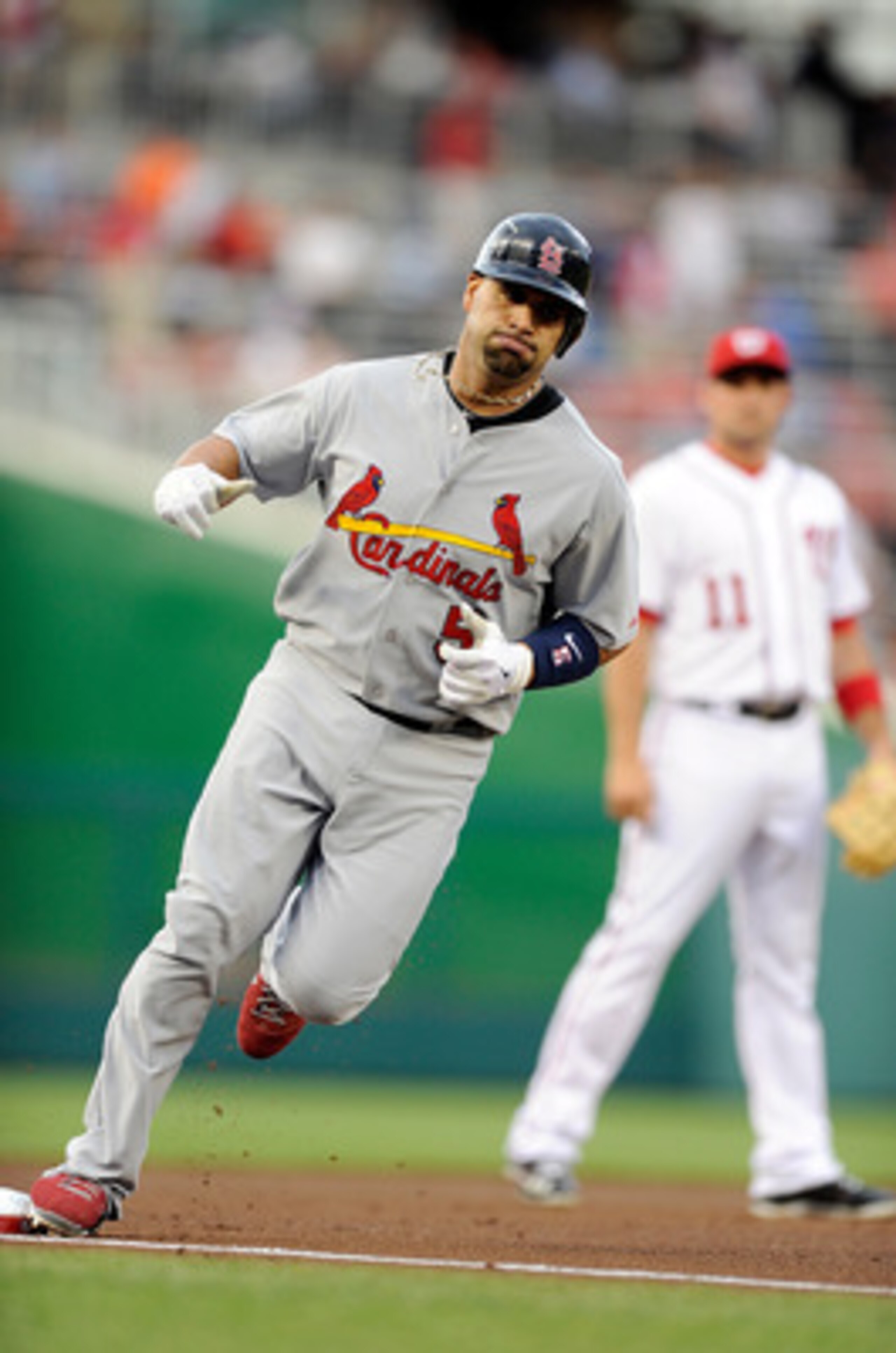 WASHINGTON, DC - JUNE 14:  Albert Pujols #5 of the St. Louis Cardinals rounds the bases after hitting a home run in the first inning against the Washington Nationals at Nationals Park on June 14, 2011 in Washington, DC.  (Photo by Greg Fiume/Getty Images)