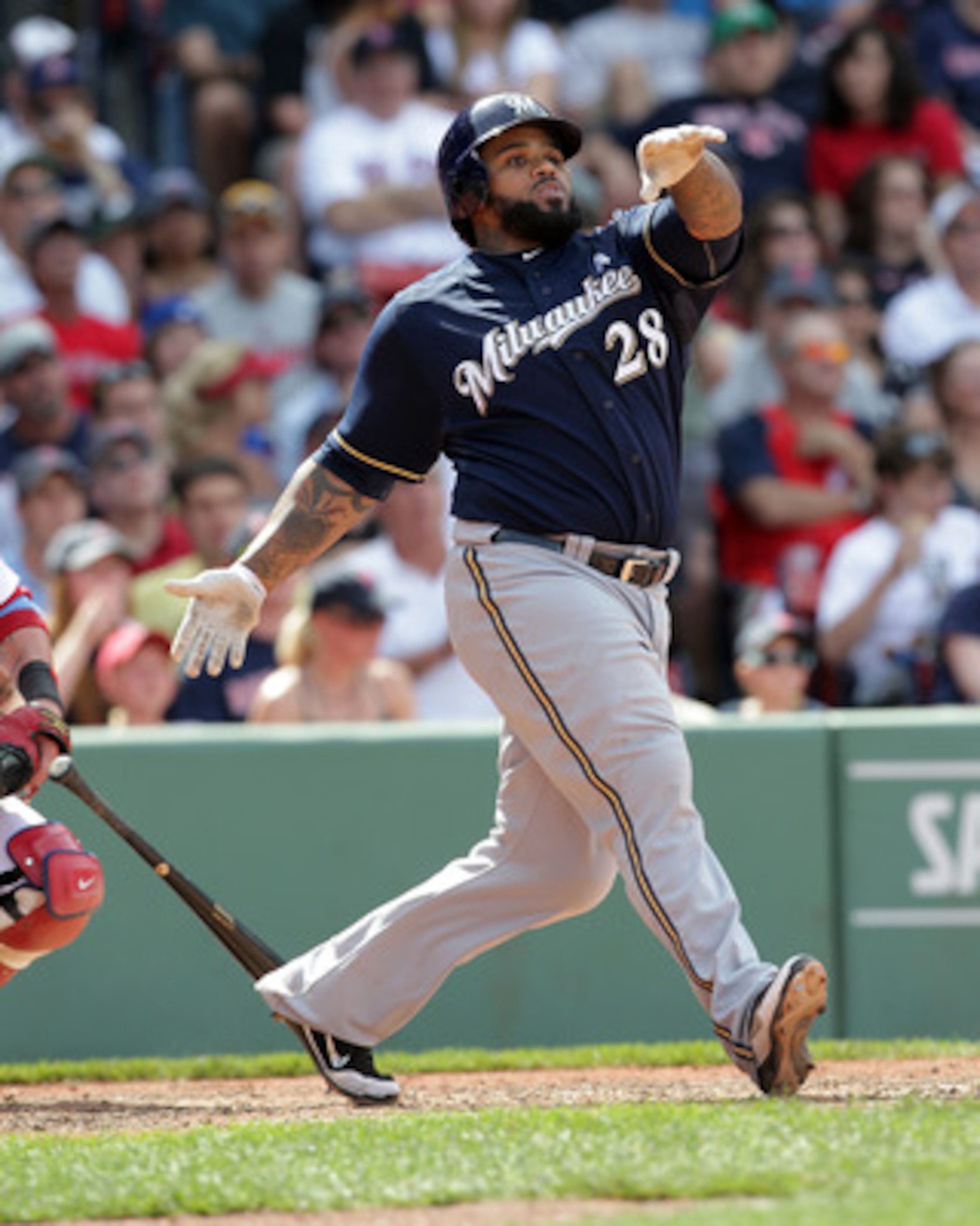 BOSTON, MA  - JUNE 19: Prince Fielder #28 of the Milwaukee Brewers connects for a home run against the Boston Red Sox at Fenway Park on June 19, 2011 in Boston, Massachusetts.  (Photo by Jim Rogash/Getty Images)