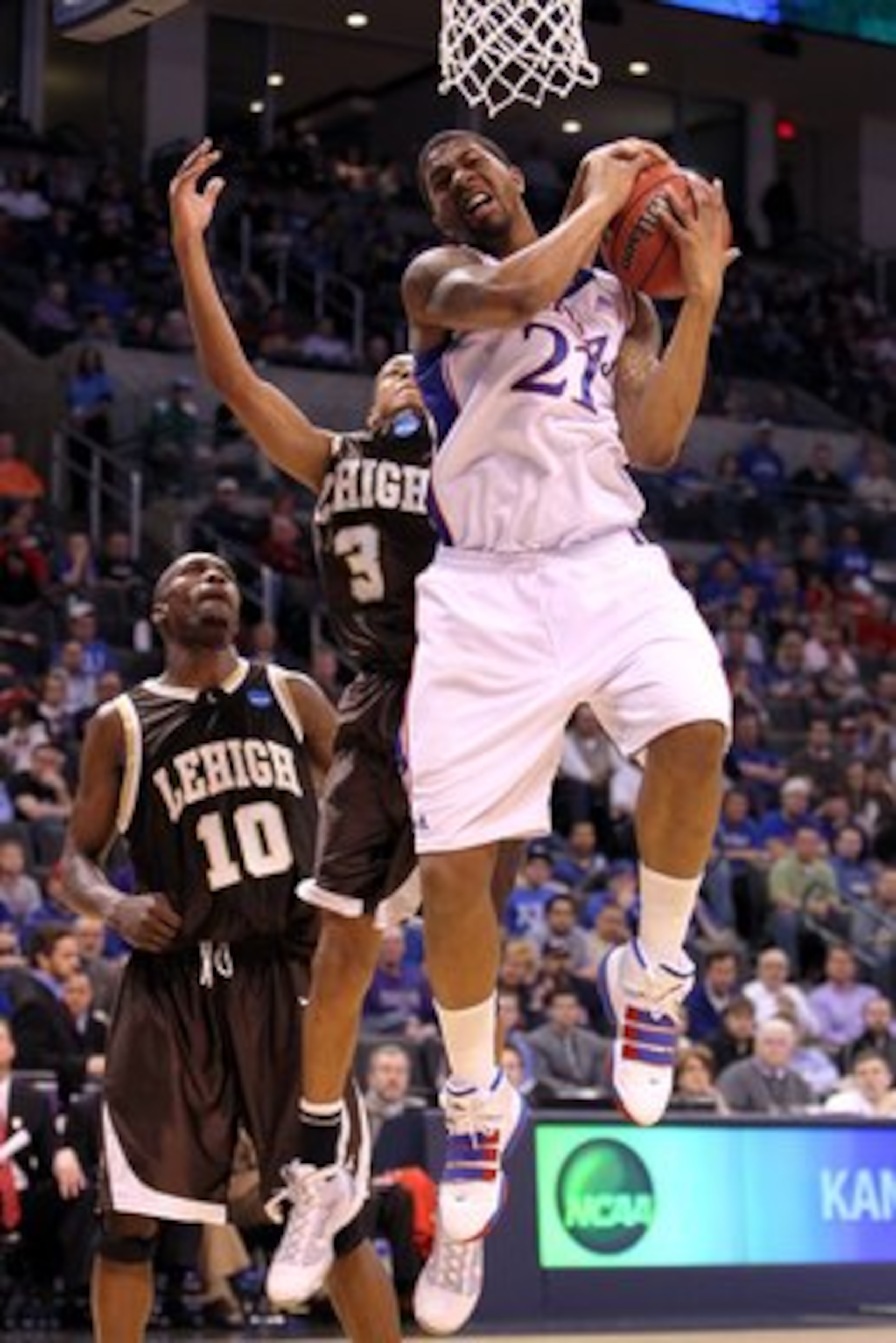 OKLAHOMA CITY - MARCH 18:  Markieff Morris #21 of the Kansas Jayhawks grabs a rebound against the Lehigh Mountain Hawks during the first round of the 2010 NCAA men's basketball tournament at Ford Center on March 18, 2010 in Oklahoma City, Oklahoma.  (Phot