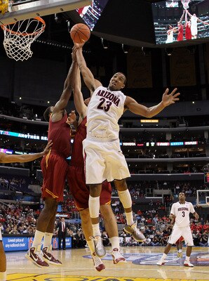 LOS ANGELES, CA - MARCH 11:  Derrick Williams #23 of the Arizona Wildcats goes up for a rebound in front of Alex Stepheson #1 of the USC Trojans in the second half in the semifinals of the 2011 Pacific Life Pac-10 Men's Basketball Tournament at Staples Ce