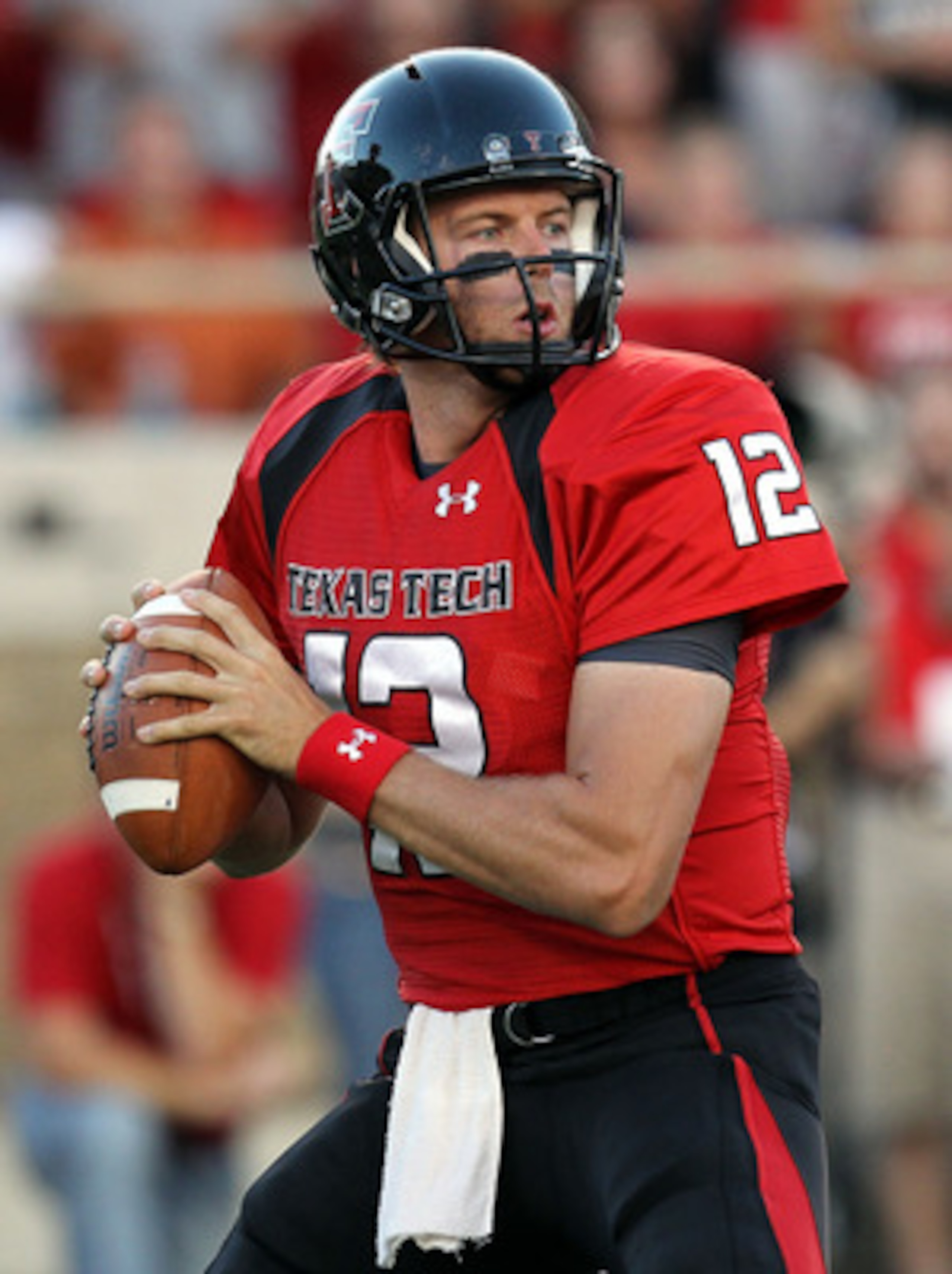 LUBBOCK, TX - SEPTEMBER 18:  Quarterback Taylor Potts #12 of the Texas Tech Red Raiders drops back to pass against the Texas Longhorns at Jones AT&T Stadium on September 18, 2010 in Lubbock, Texas.  (Photo by Ronald Martinez/Getty Images)