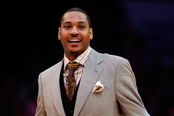 LOS ANGELES, CA - FEBRUARY 18:  Carmelo Anthony of the Denver Nuggets reacts as he takes his seat to watch the T-Mobile Rookie Challenge and Youth Jam at Staples Center on February 18, 2011 in Los Angeles, California.  (Photo by Kevork Djansezian/Getty Im
