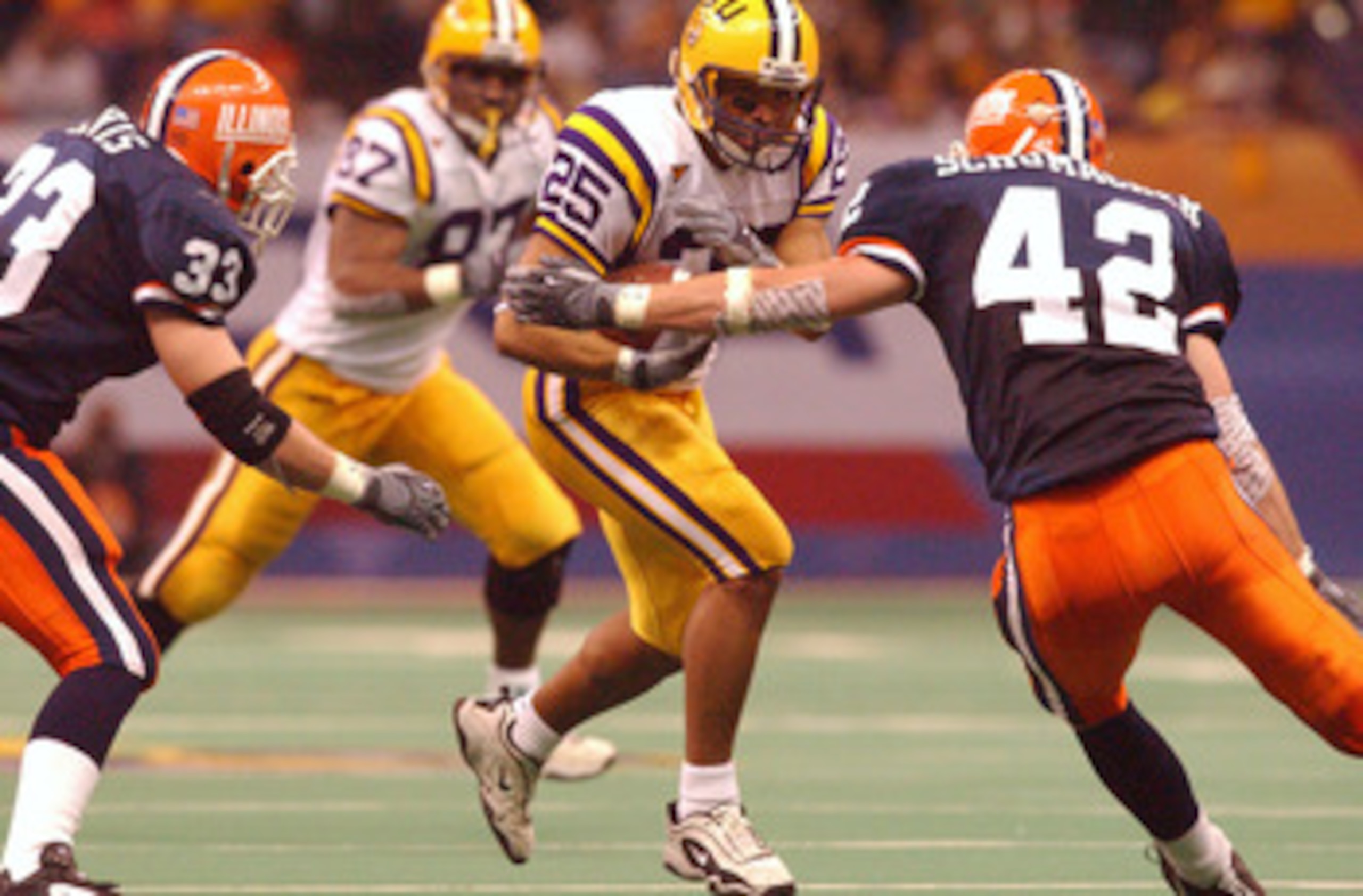 01 Jan 2002 : Josh Reed #25 of LSU in action against Jerry Schumacher #42 of Illinois during the Sugar Bowl game at the  Louisiana Superdome in New Orleans, Louisiana. LSU won 47-34. DIGITAL IMAGE. Mandatory Credit: Harry How/Getty Images