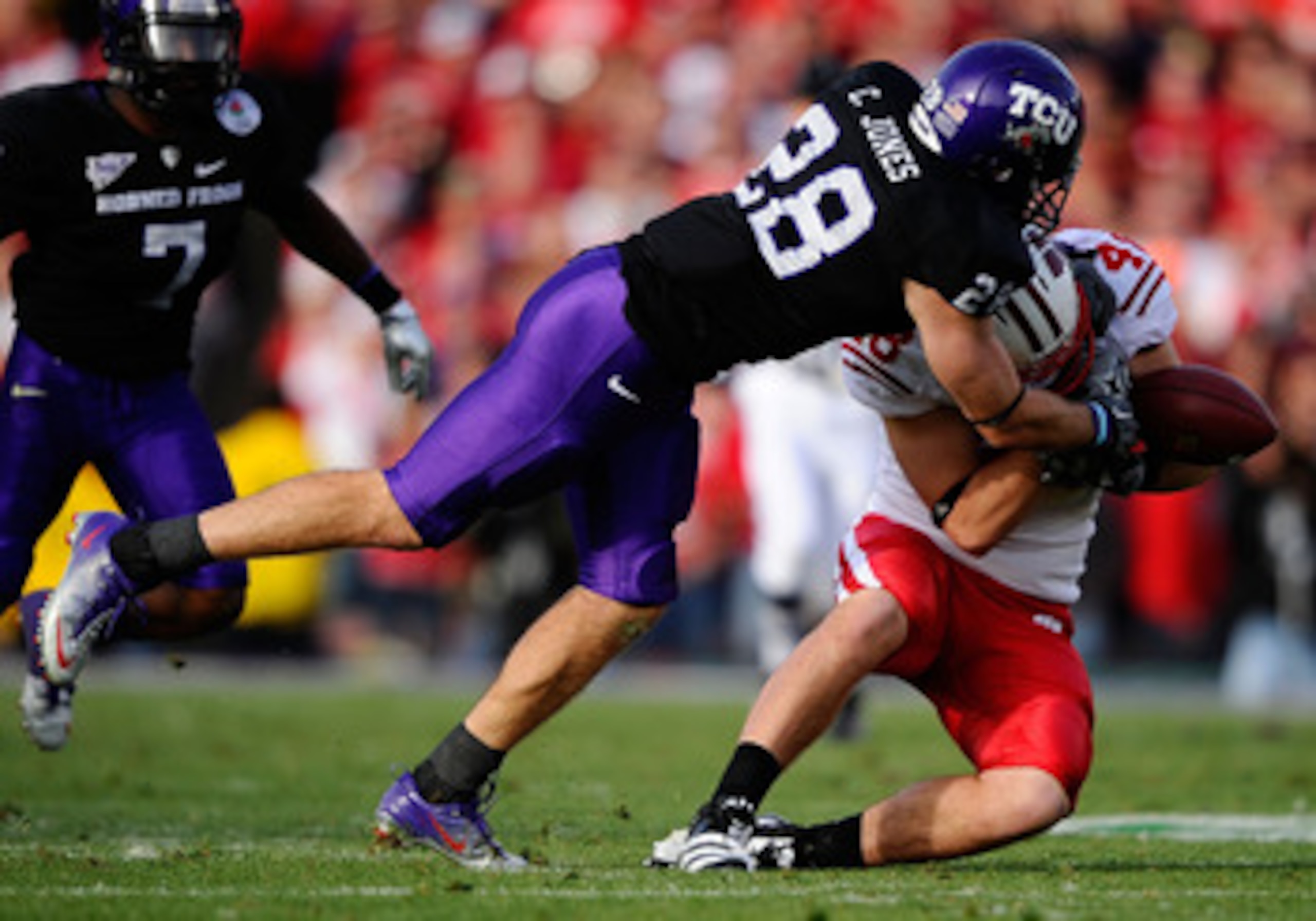 PASADENA, CA - JANUARY 01:  Safety Colin Jones #28 of the TCU Horned Frogs breaks up a pass to tight end Jacob Pedersen #48 of the Wisconsin Badgers in the 97th Rose Bowl game on January 1, 2011 in Pasadena, California.  (Photo by Kevork Djansezian/Getty 