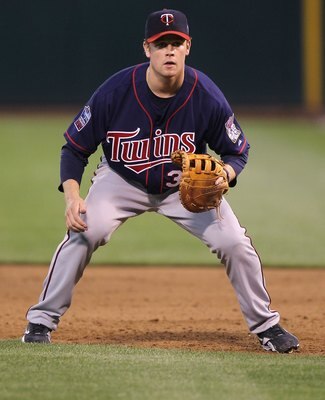 OAKLAND, CA - JUNE 04:  Justin Morneau #33 of the Minnesota Twins plays at first base against the Oakland Athletics during an MLB game at the Oakland-Alameda County Coliseum on June 4, 2010 in Oakland, California.  (Photo by Jed Jacobsohn/Getty Images)